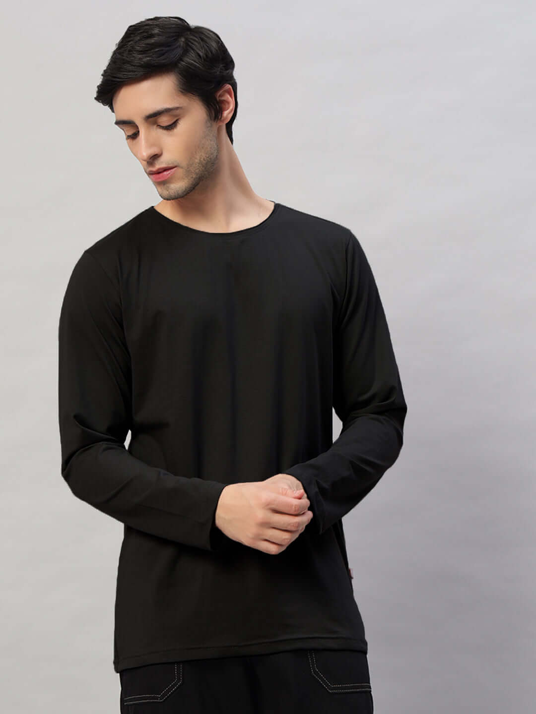 Model wearing Omni Slim Fit Sweatshirt in black, made of 100% cotton, premium heavy gauge fabric. Perfect for a trendy, comfortable look.