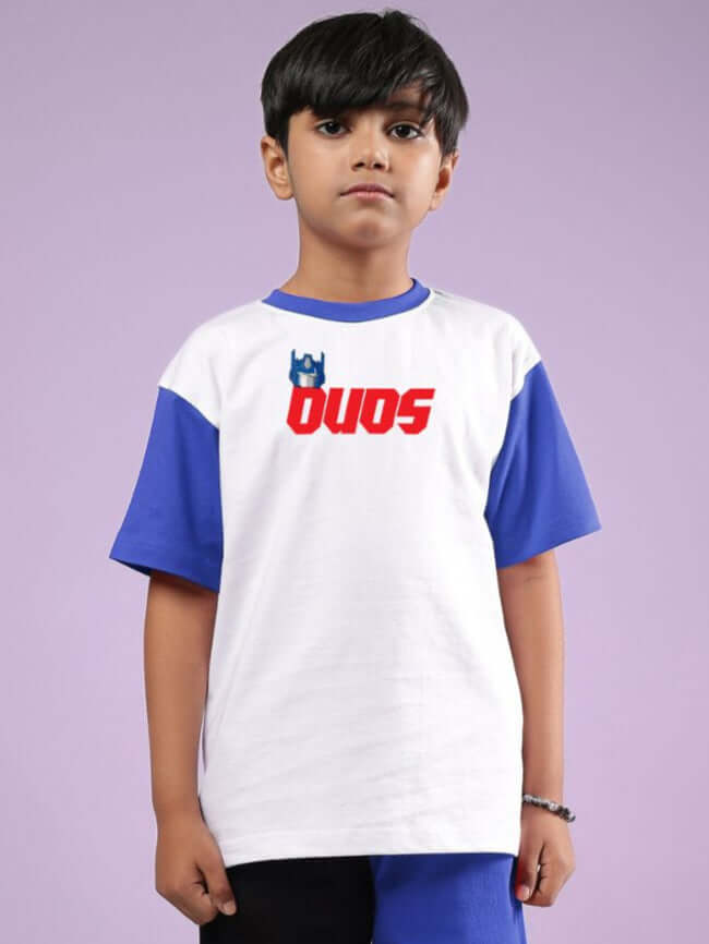 Child wearing white and blue Optimus Prime T-shirt by DUDS, customizable fit available.