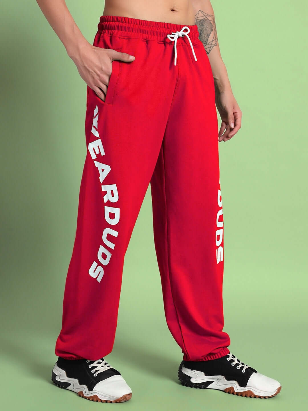 Model wearing Ellen Relaxed Fit Jogger in red, stylish and comfortable, perfect for casual wear, customizable fit available for prepaid orders