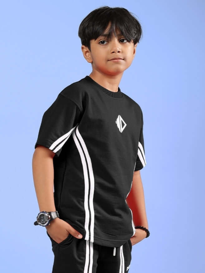 OUTLOOK T-SHIRT FOR BOYS GIRLS BLACK - Sleek black tee worn by a boy, perfect for casual and active wear, matching various outfits.