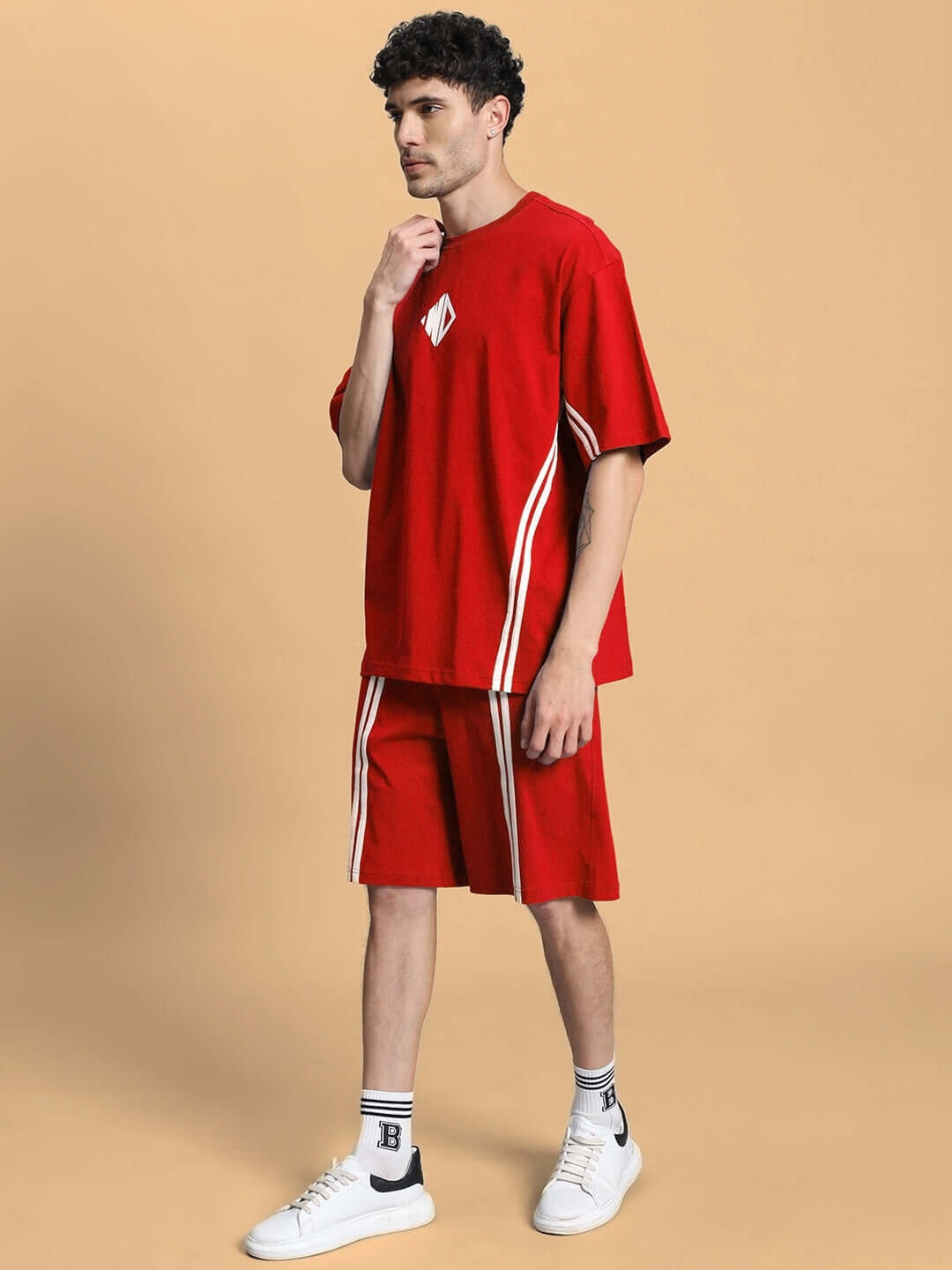 Man wearing OUTLOOK SUMMER CO-ORD SHORTS SET RED showcasing stylish red t-shirt and shorts outfit for casual summer wear.