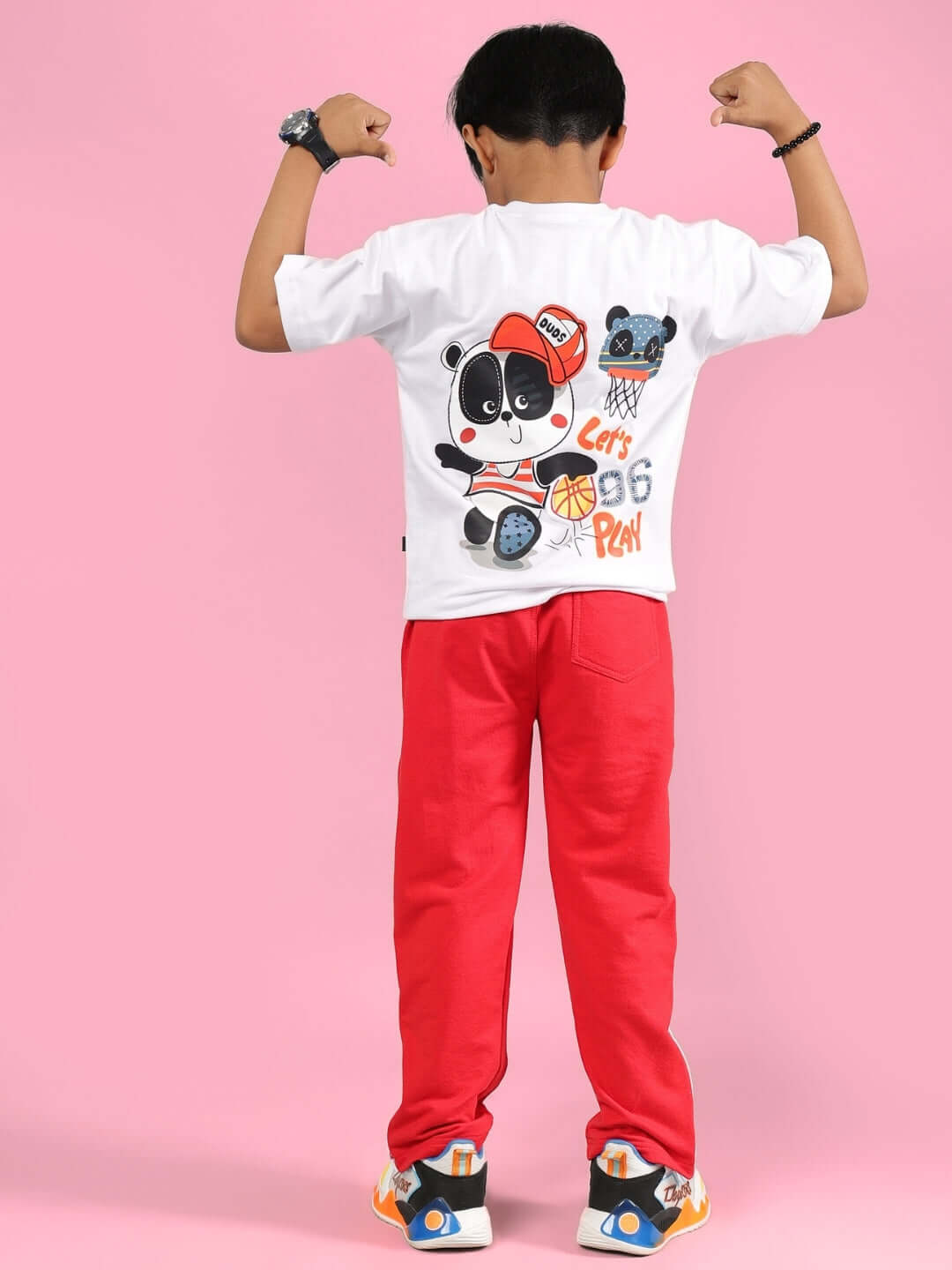 Child wearing PALOMA CO-ORD FOR BOYS & GIRLS WHITE RED, featuring playful panda print and vibrant red pants, ideal for stylish outings.