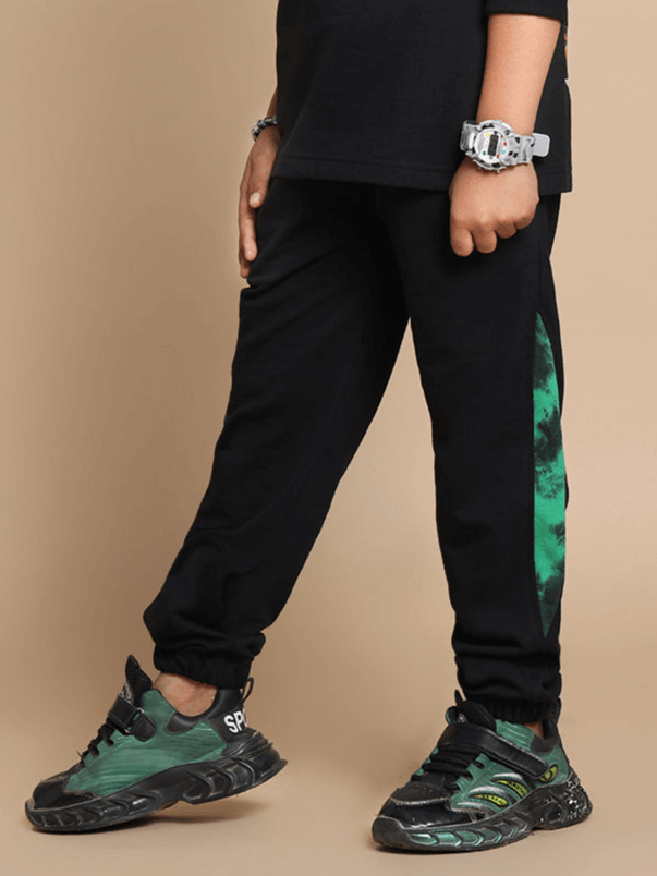 Child wearing Panda Joggers for boys and girls in green, showcasing comfortable fit and stylish design, suitable for custom sizing.