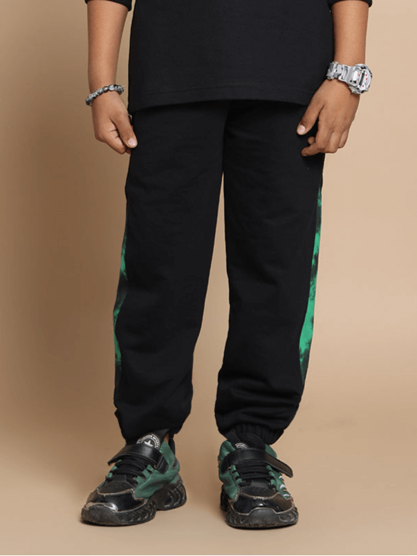 Child wearing green Panda Joggers with custom fit option from DUDS.