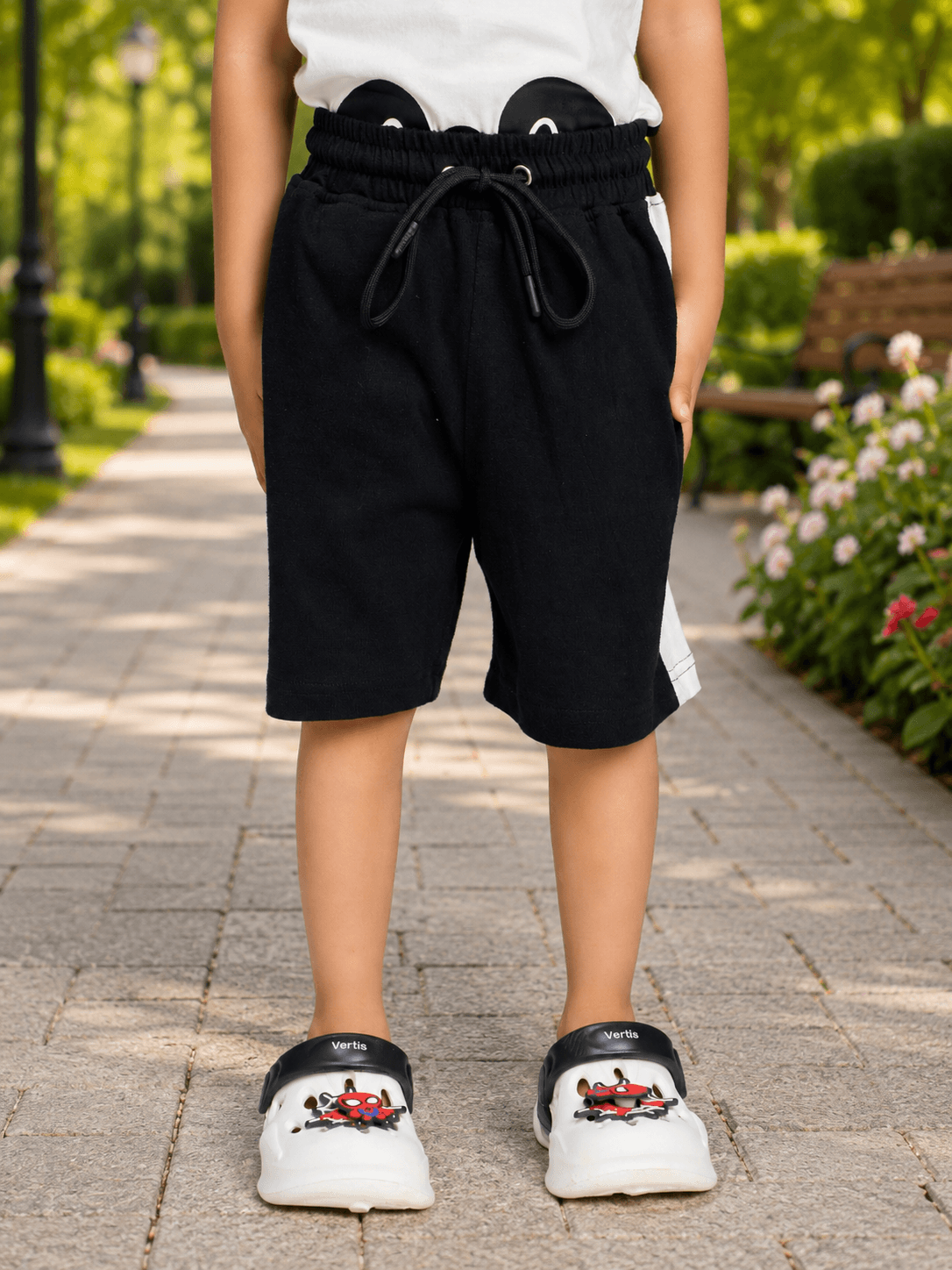 PANDA POP SLEEVELESS CO-ORD FOR BOYS GIRLS BLACK WHITE showcased with black shorts and playful panda design.