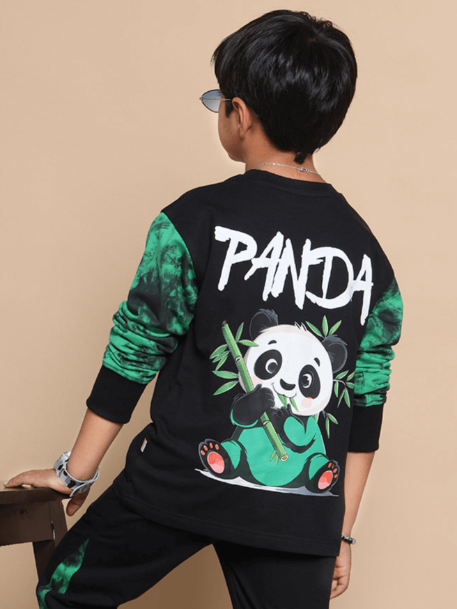 Child wearing a black oversized sweatshirt with a playful panda design, tailored for boys and girls. Made by experienced tailors.