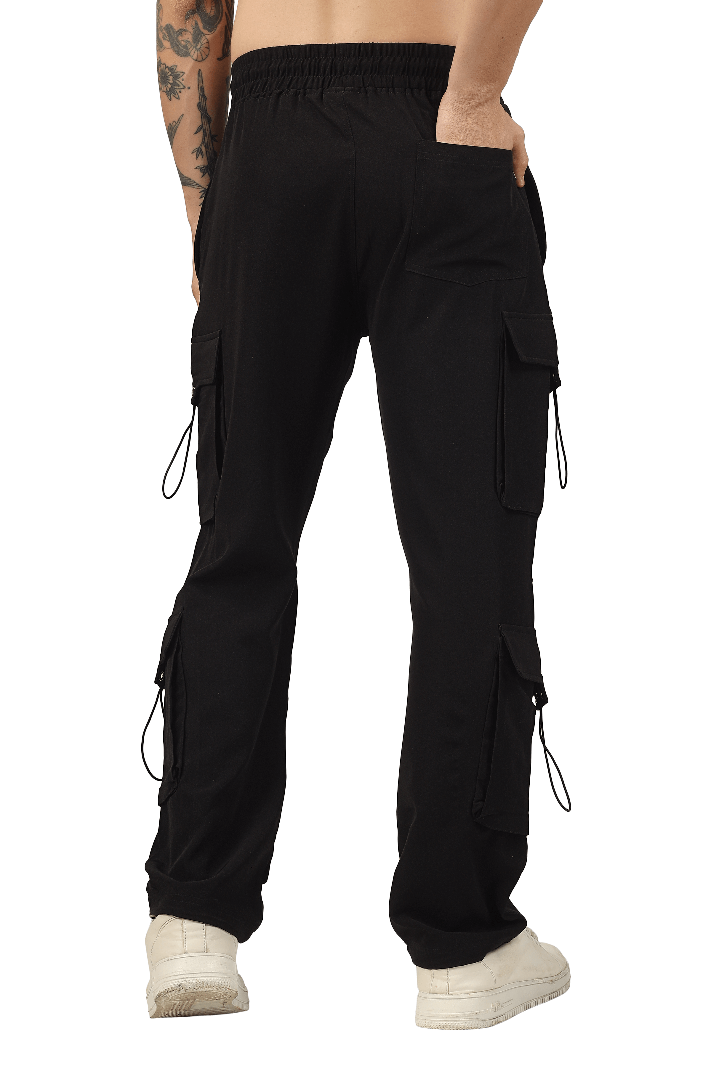 Back view of black Parachute Cargo Pants with adjustable custom fit option, featuring side pockets and a relaxed leg design, worn by a model.