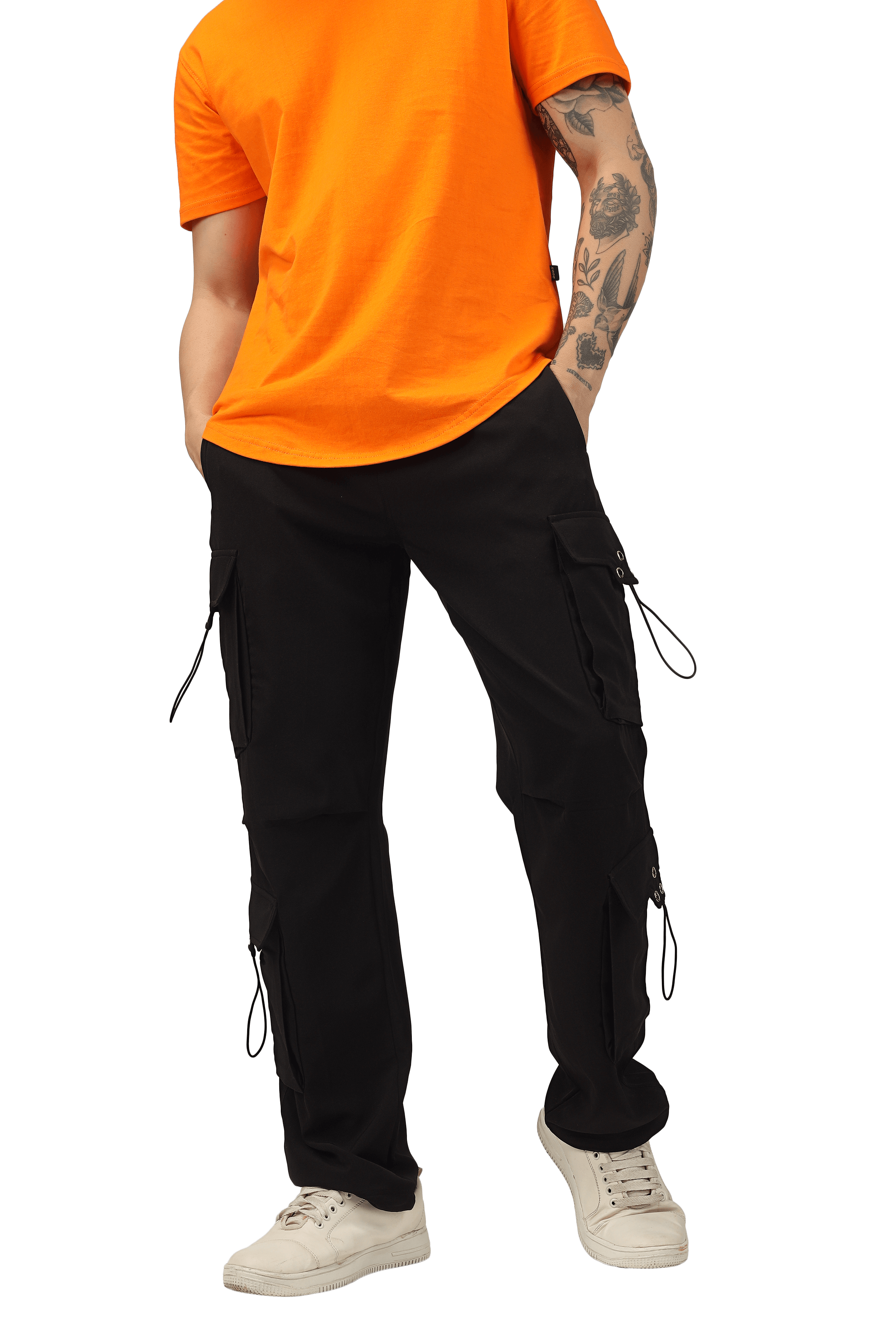 Model wearing black parachute cargo pants with an orange shirt, showcasing customizable fit options from DUDS.
