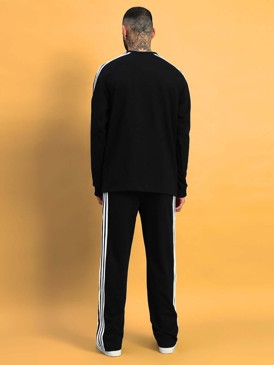 Back view of PARKA OVERSIZED CO-ORD SET BLACK, featuring a comfortable, relaxed fit and sleek design for a stylish look.