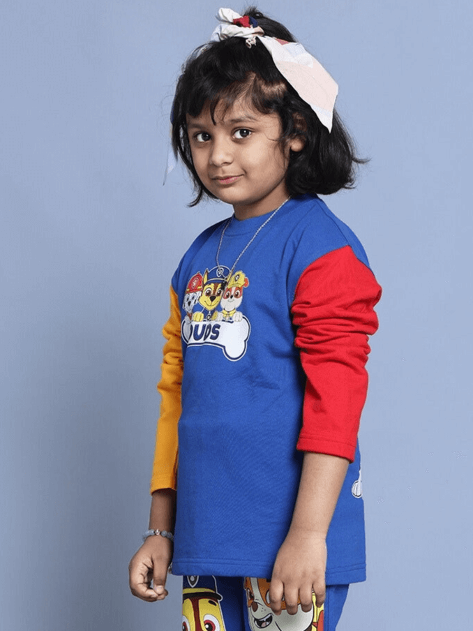 Child wearing a blue Paw Patrol over-sized sweatshirt with colorful sleeves, suitable for boys and girls, made of 100% cotton.