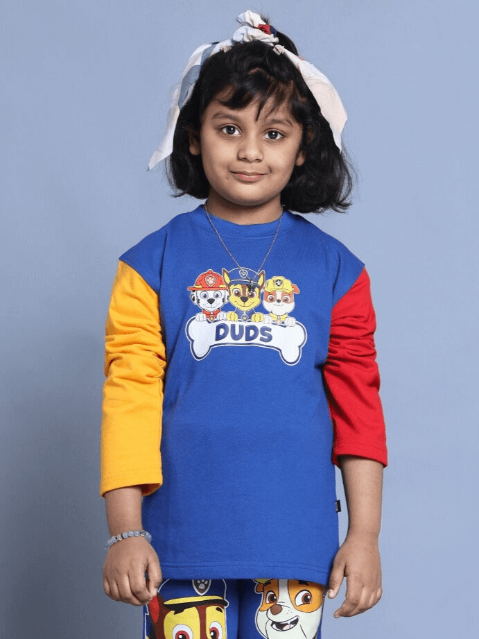 Child wearing PAW PATROL over-sized blue sweatshirt with multi-colored sleeves, featuring cartoon characters for boys and girls.