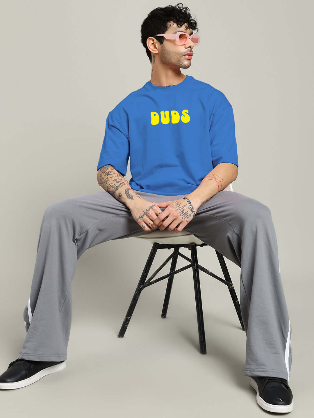 Person wearing PERSONAL TRUTH OVERSIZED T-SHIRT BLUE, showcasing bold streetwear style with oversized fit and comfortable design.
