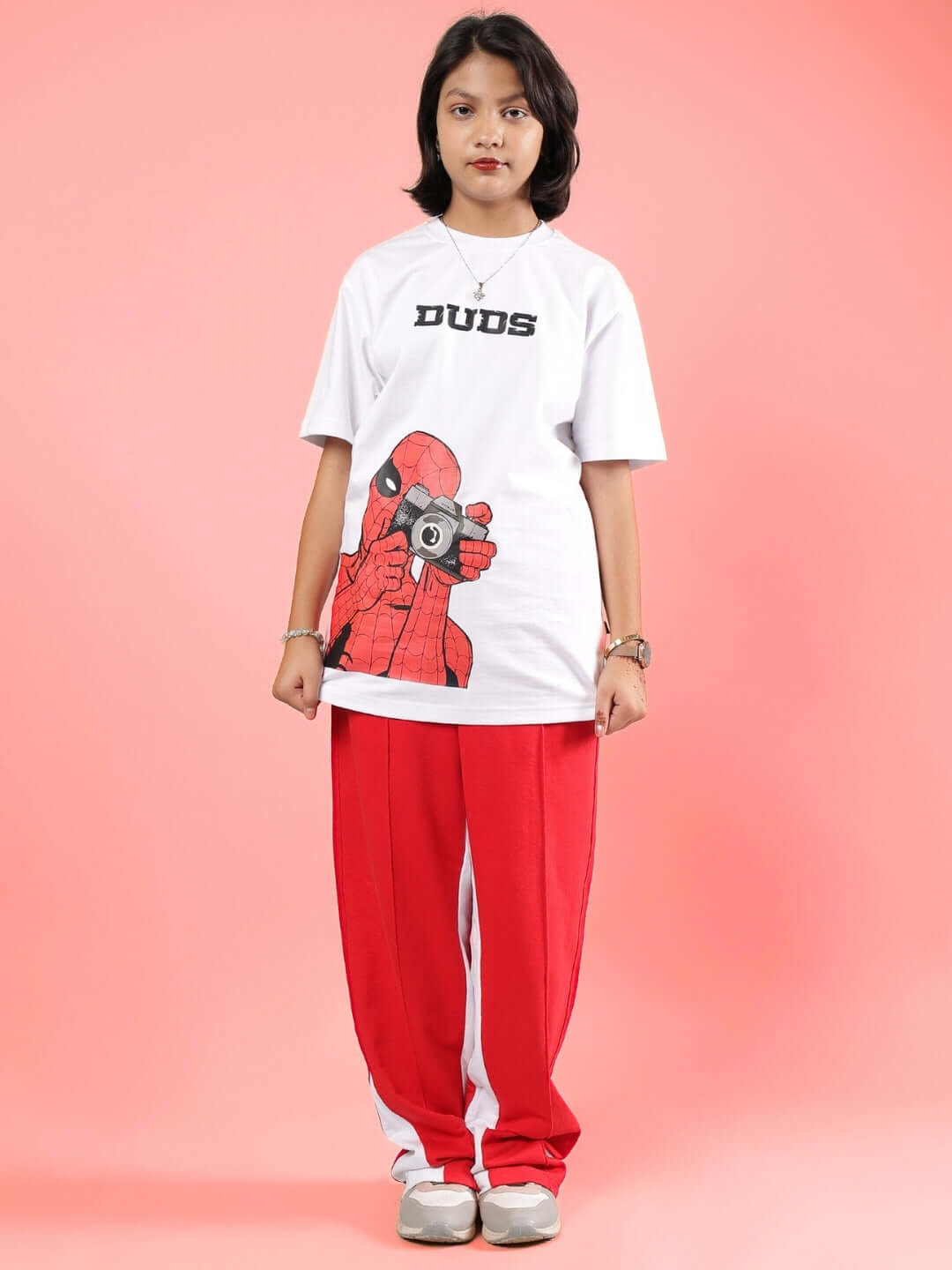 Child wearing PETER CO-ORD FOR BOYS & GIRLS WHITE-RED outfit with a playful cartoon design. Available for custom fit orders at DUDS.