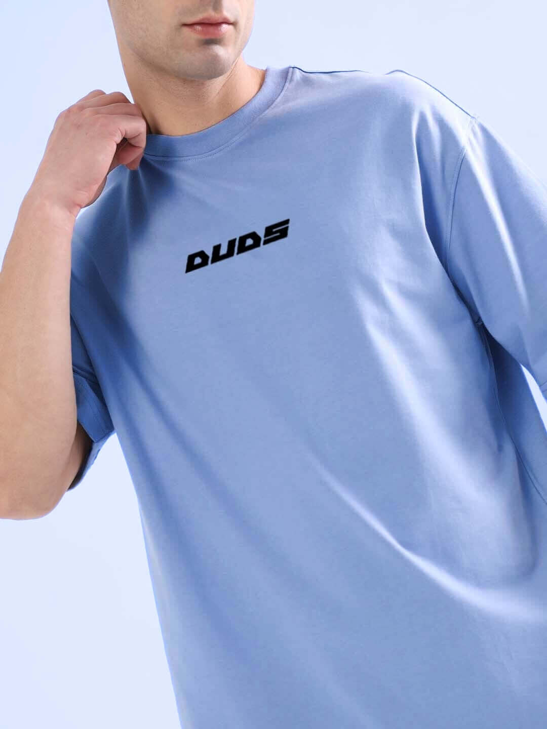 Cobalt blue oversized T-shirt with text logo, made from premium heavy gauge fabric, featuring 97% cotton and 3% elastane blend.