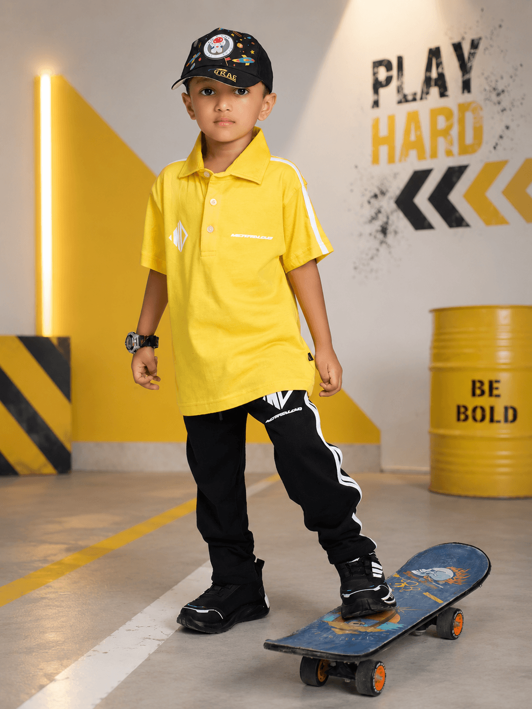 CHAMPION TRACK JOGGER FOR BOYS GIRLS BLACK worn by a boy skating in a bright environment, showcasing active wear.