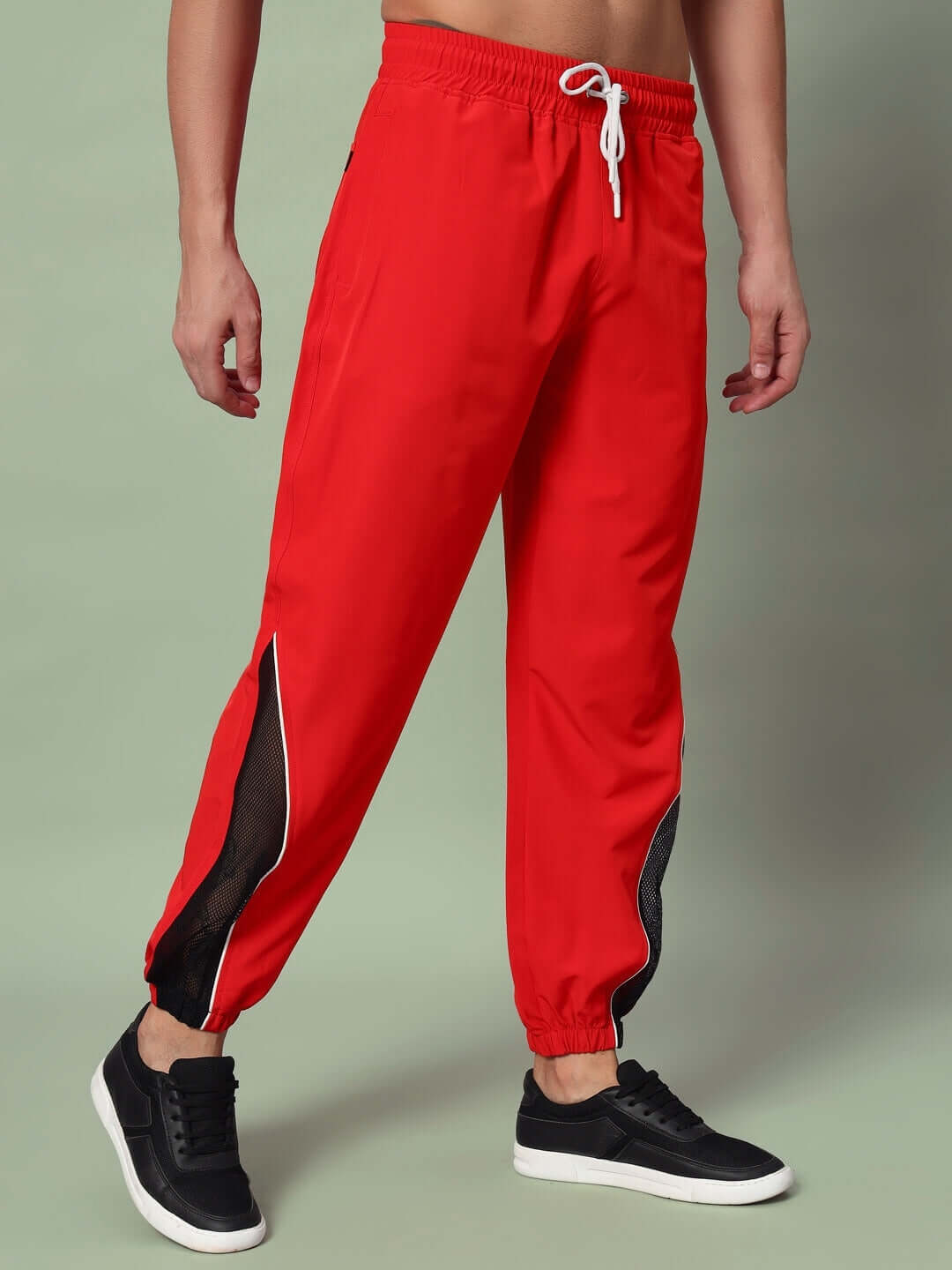 Red PLEXUS joggers made by DUDS, featuring comfortable fit and customizable sizing options for a tailored experience.