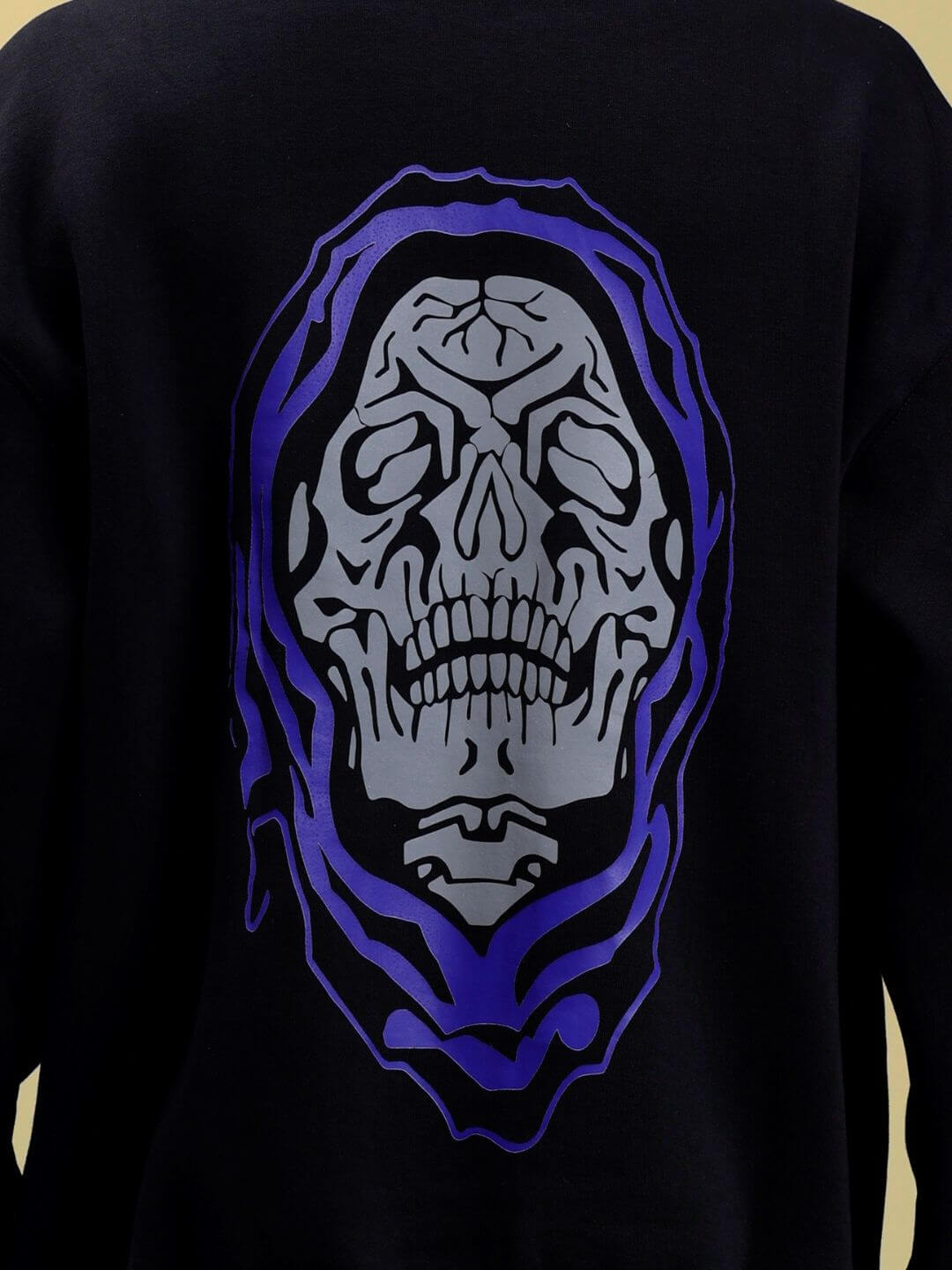 Back view of POISON SKULL REFLECTOR OVERSIZE HOODIE BLACK with reflective skull graphic