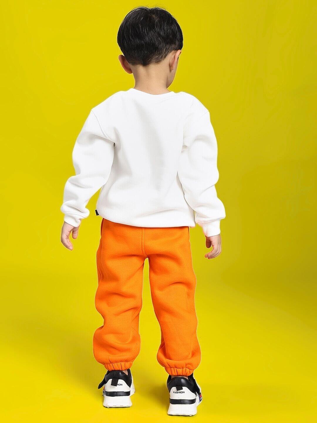 POKEMON CO-ORD FOR BOYS AND GIRLS OFF-WHITE ORANGE outfit with a child wearing white hoodie and orange joggers, rear view.