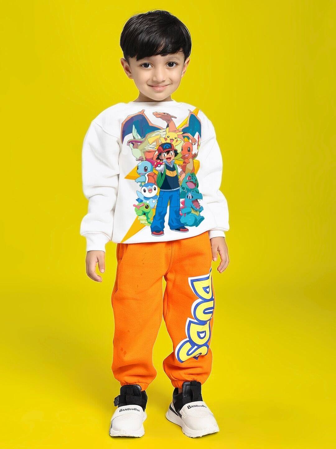Child wearing POKEMON CO-ORD FOR BOYS AND GIRLS OFF-WHITE ORANGE with hoodie and joggers featuring Pokémon illustrations on yellow background.