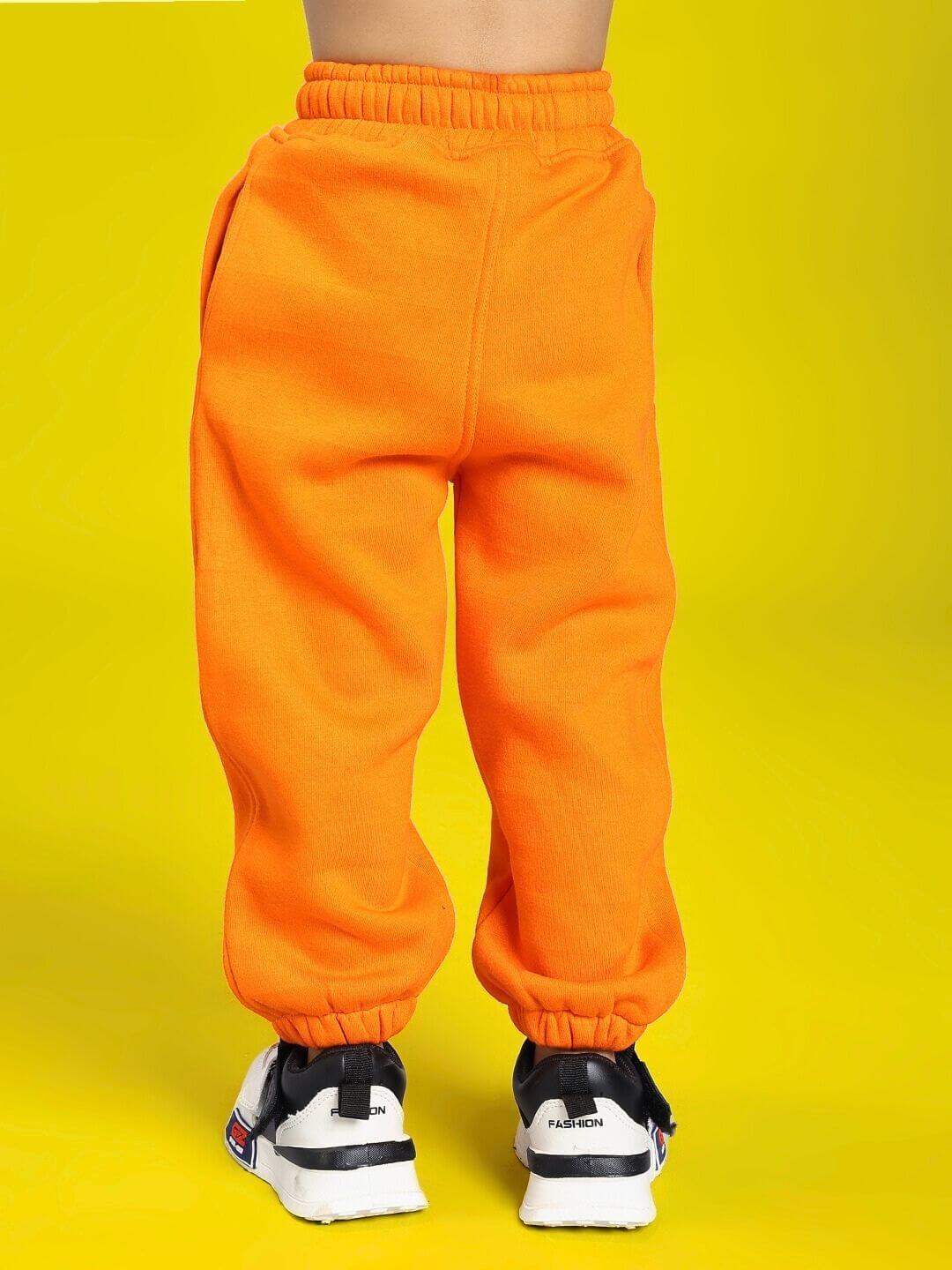 POKEMON TOON FLEECE JOGGER FOR BOYS AND GIRLS ORANGE, vibrant orange jogger pants shown from behind on a bright yellow background.