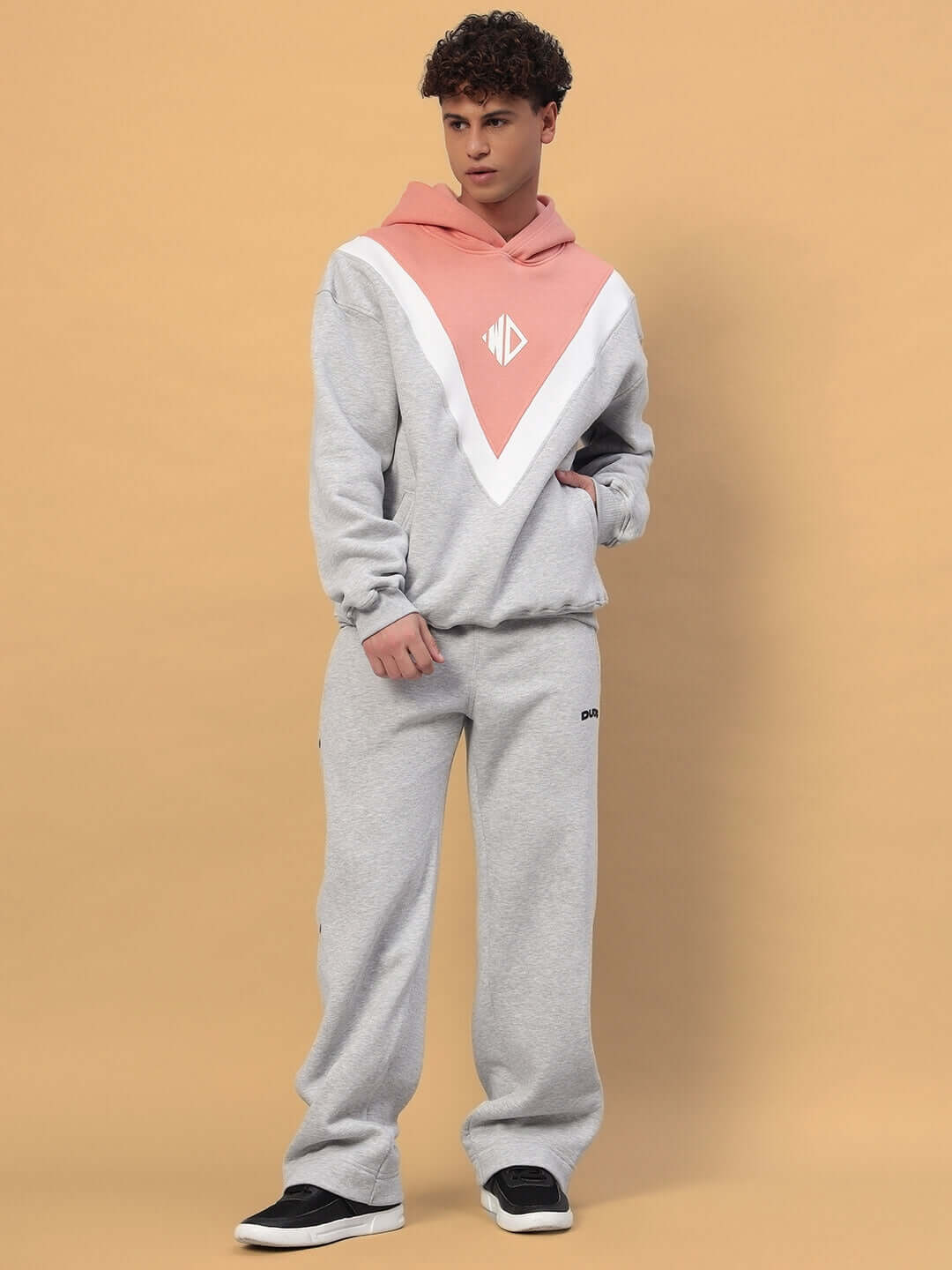 Man wearing POLAR FLEECE COLORBLOCK CO-ORD GREY PEACH hoodie and joggers set, stylish streetwear fashion.