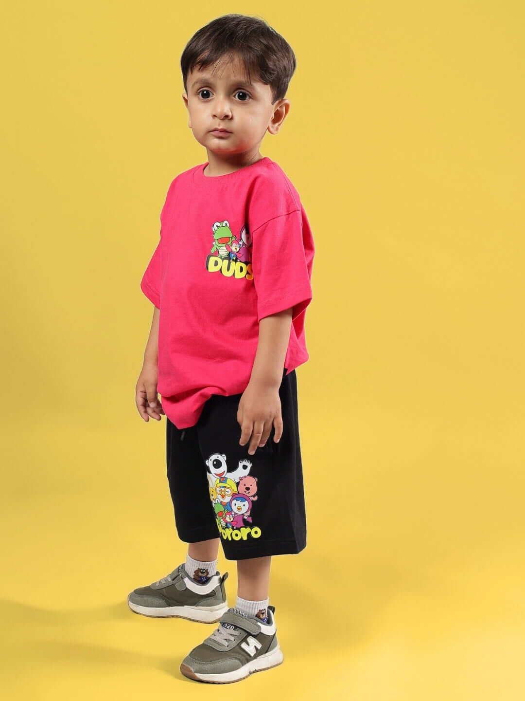 PORORO CO-ORD FOR BOYS & GIRLS PINK-BLACK outfit on child, featuring pink shirt and black shorts with cartoon design, made by DUDS.