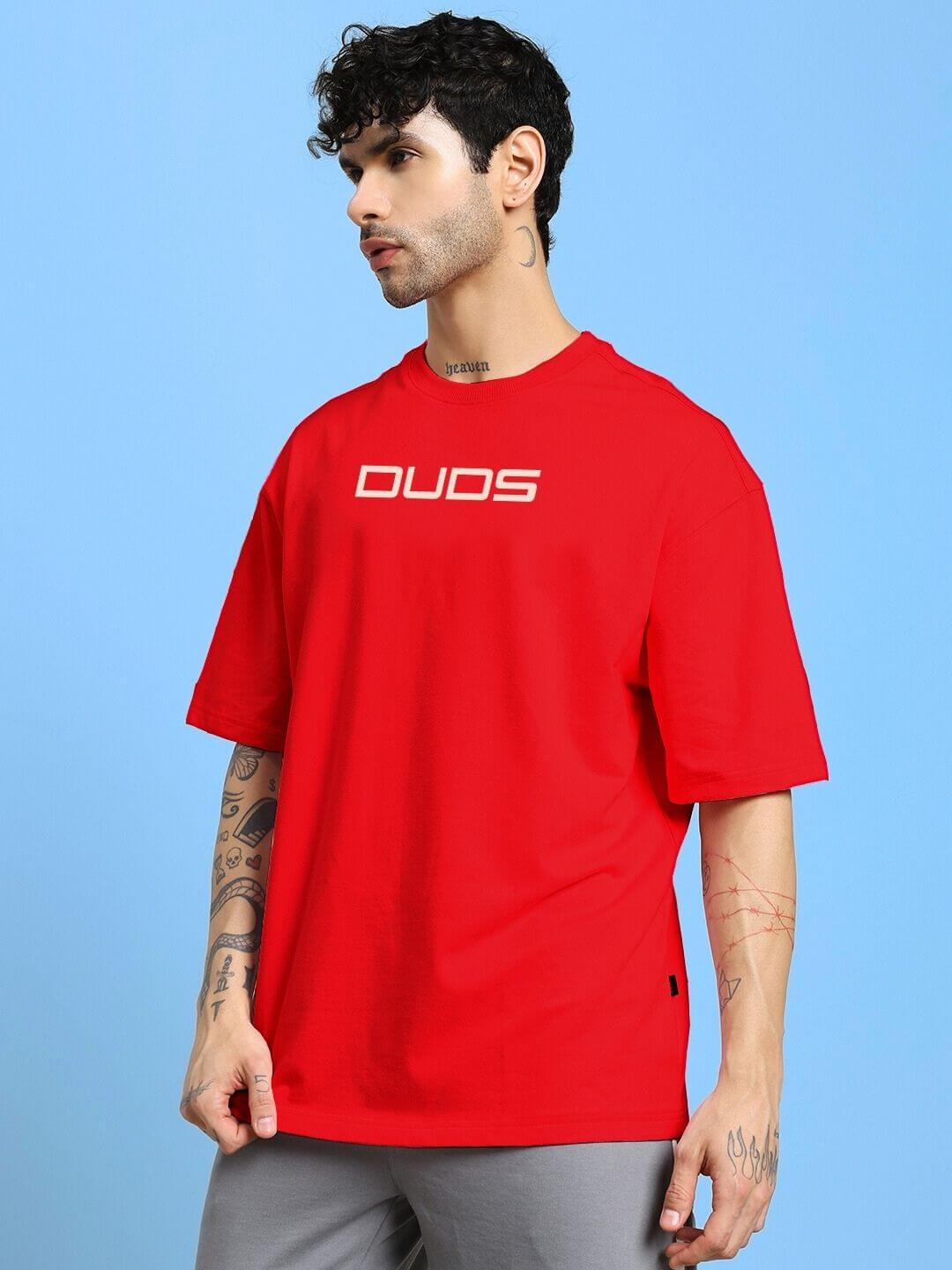 Man wearing a vivid red PORSCHE PRINTED OVER-SIZED T-SHIRT RED, showcasing bold Porsche design, relaxed fit, and streetwear style.
