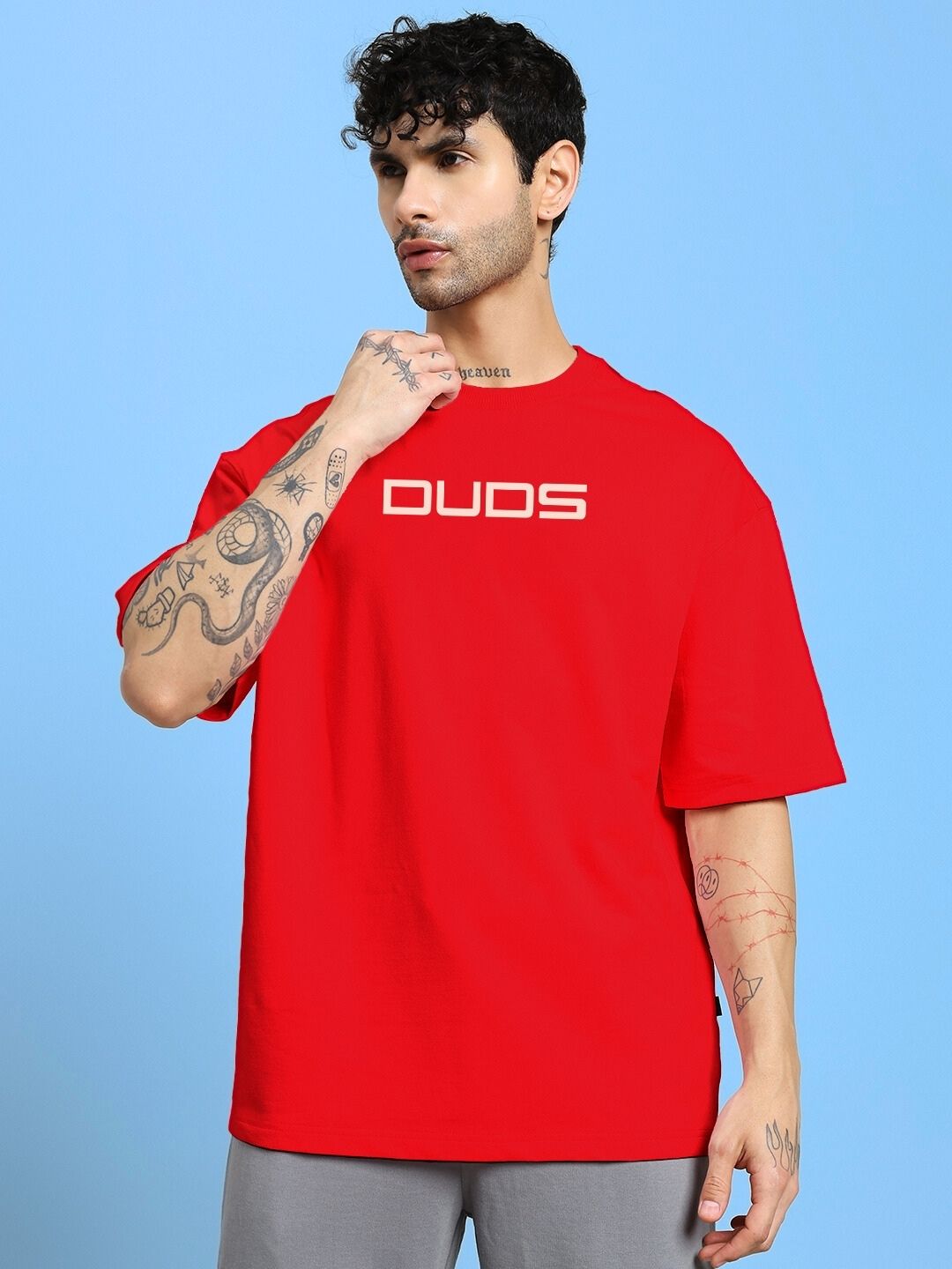 PORSCHE PRINTED OVER-SIZED T-SHIRT RED on model, showcasing casual streetwear style with bold Porsche print and premium cotton comfort.