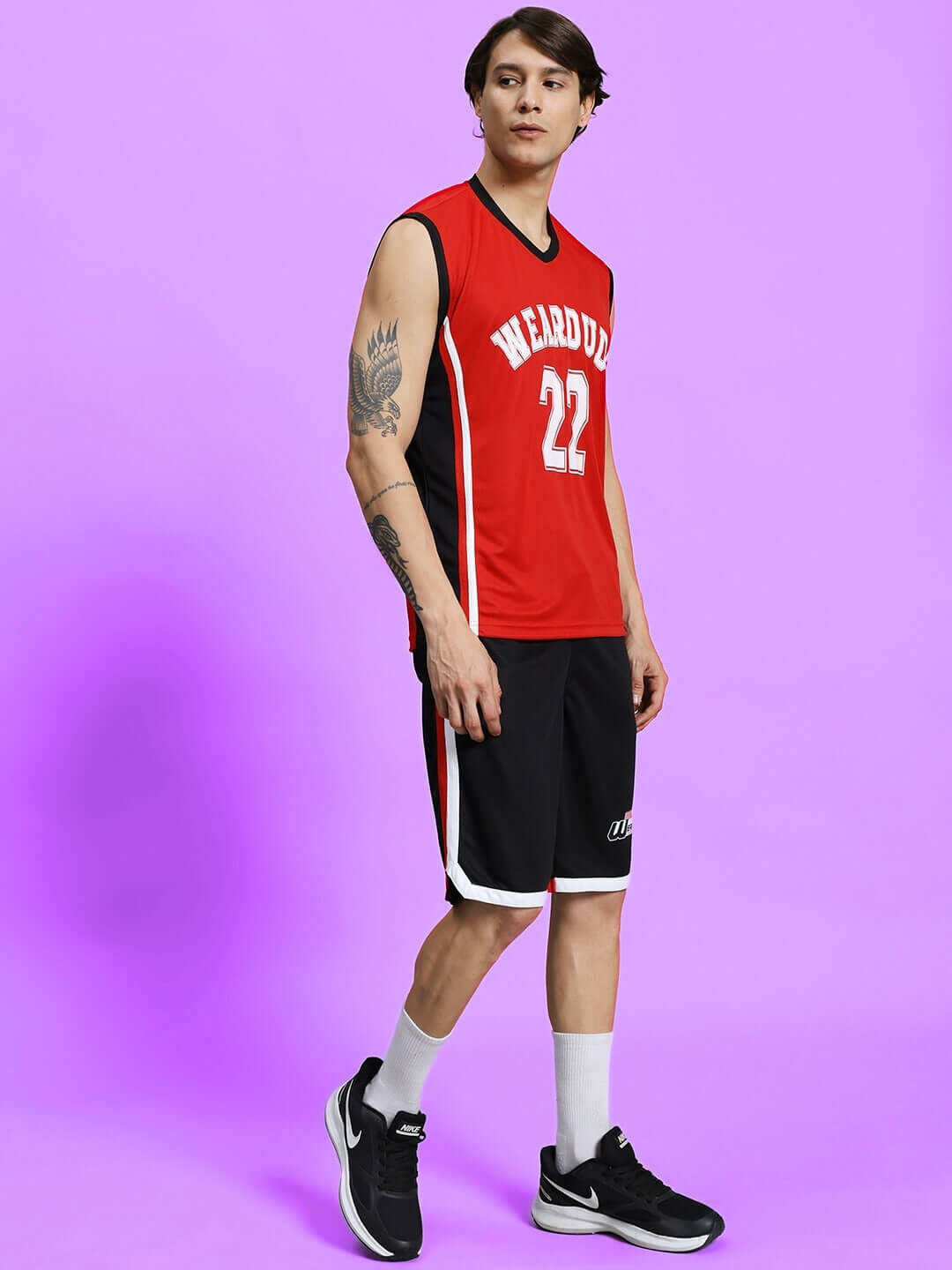 Man wearing PORTIA GYM CO-ORD SET RED-BLACK, showcasing red and black activewear for comfort, style, and performance in workouts.