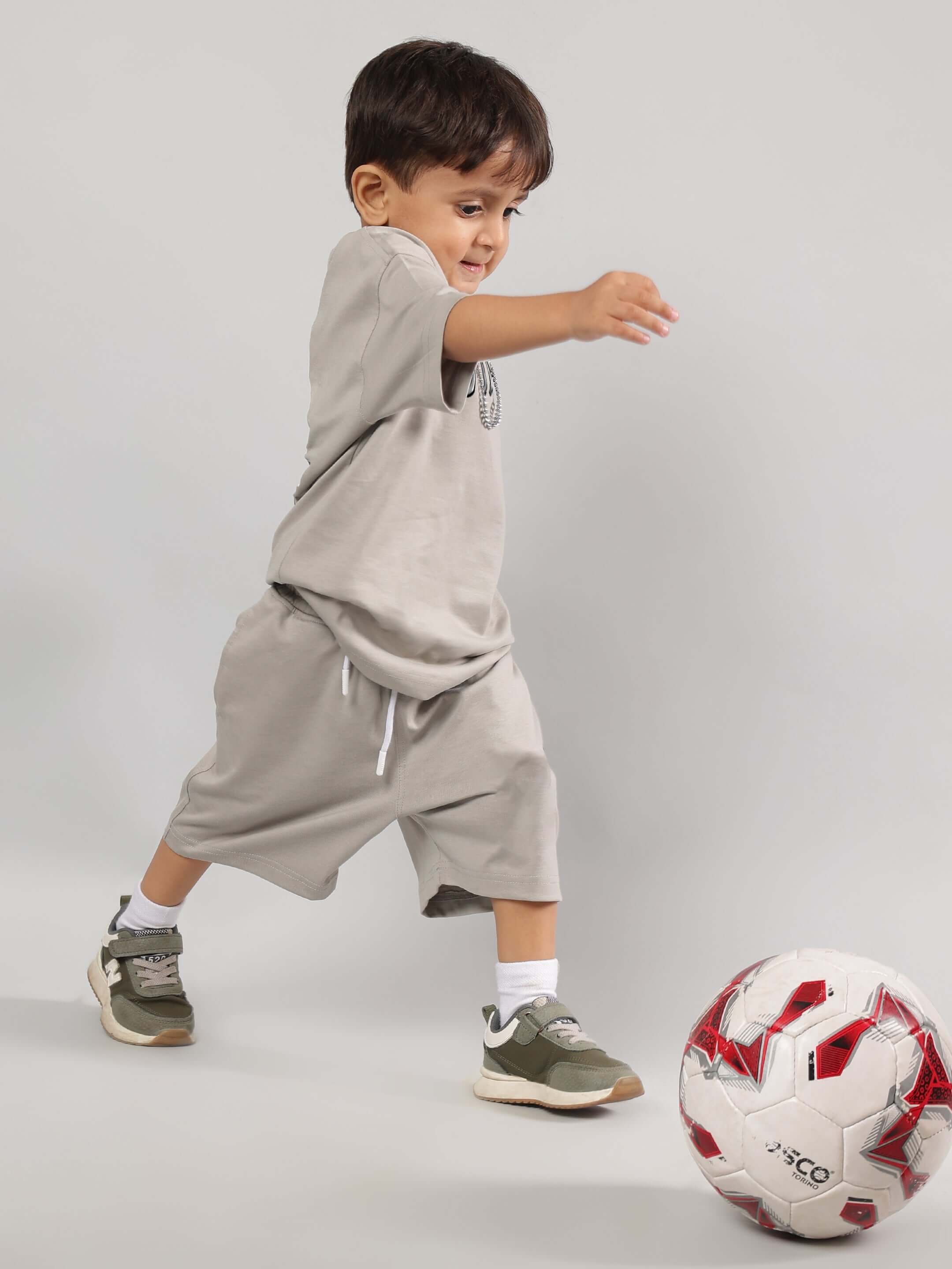 Child playing in POSITIVE RABBIT KIDS CO-ORD FOR BOYS GIRLS GREY, showing playful style and comfort.