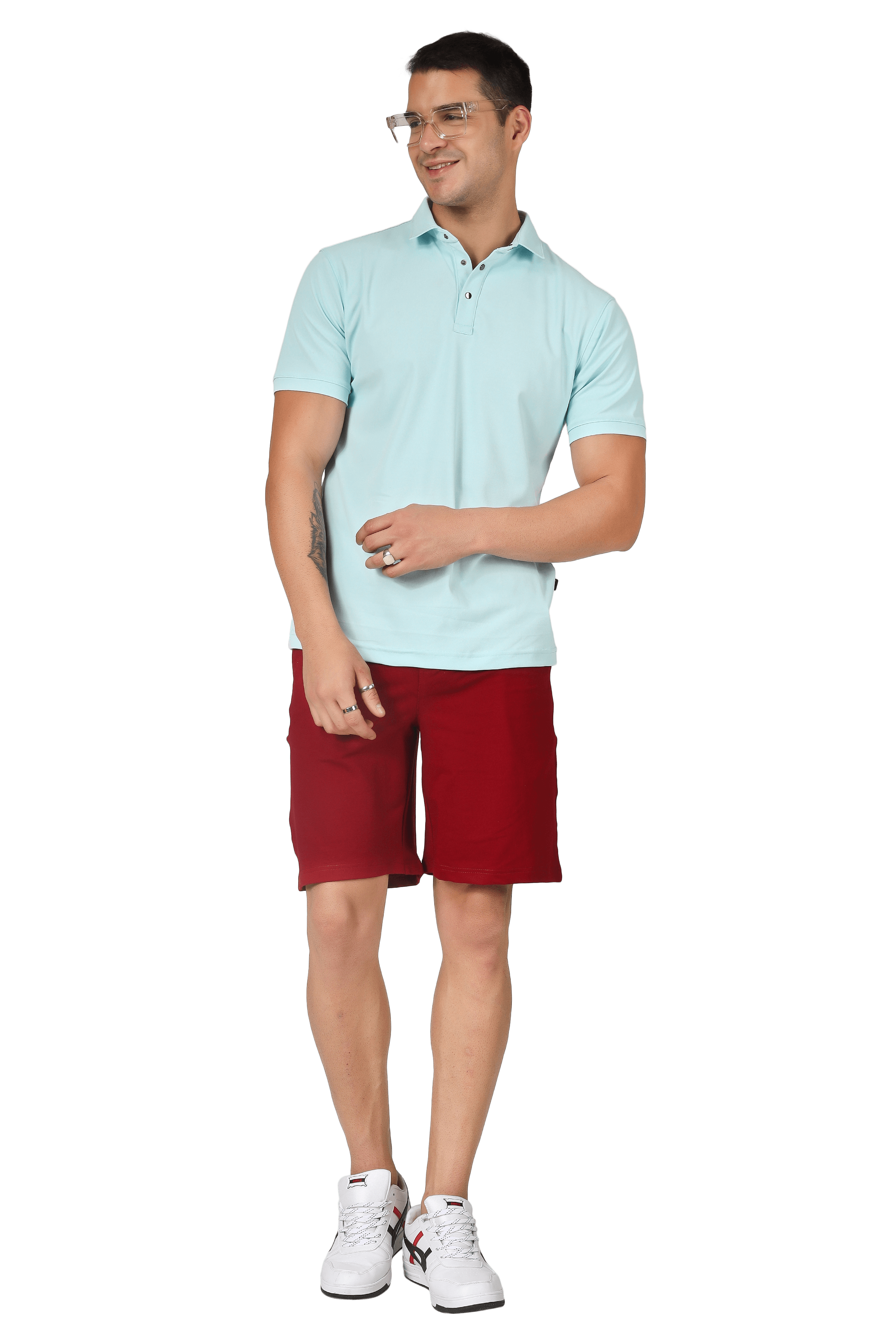 Man wearing powder blue polo neck T-shirt and red shorts with white sneakers, showcasing a casual style with superior stretch and wrinkle-free fabric.