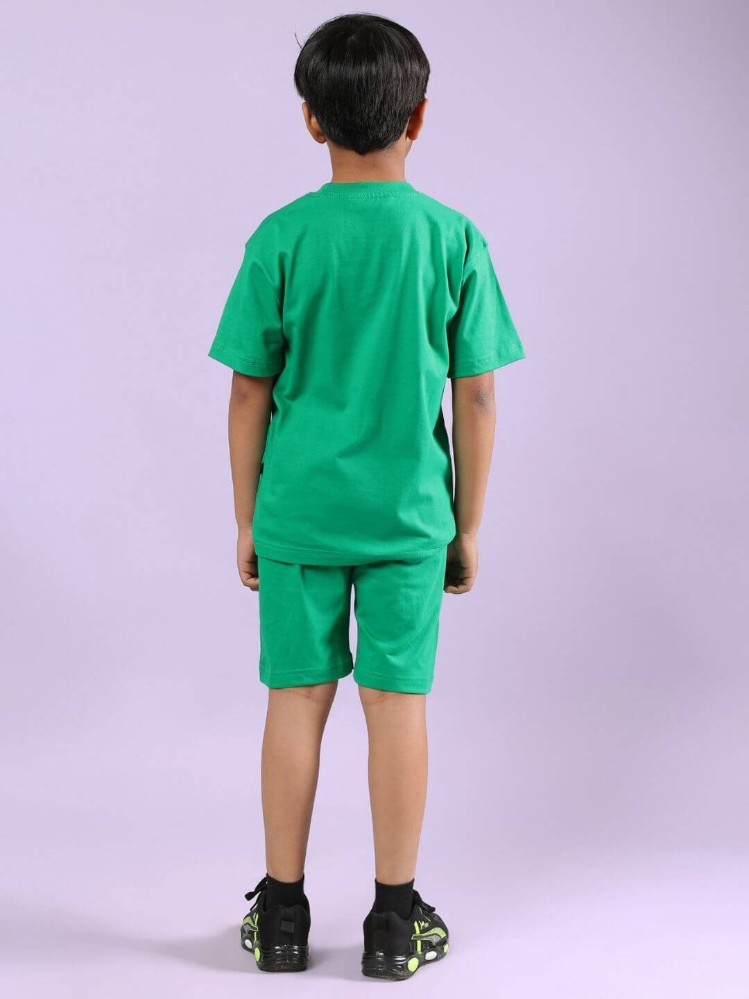 Child wearing the POWER PUNCH CO-ORD FOR BOYS AND GIRLS GREEN featuring a comfortable cotton-blend t-shirt and shorts set from behind.