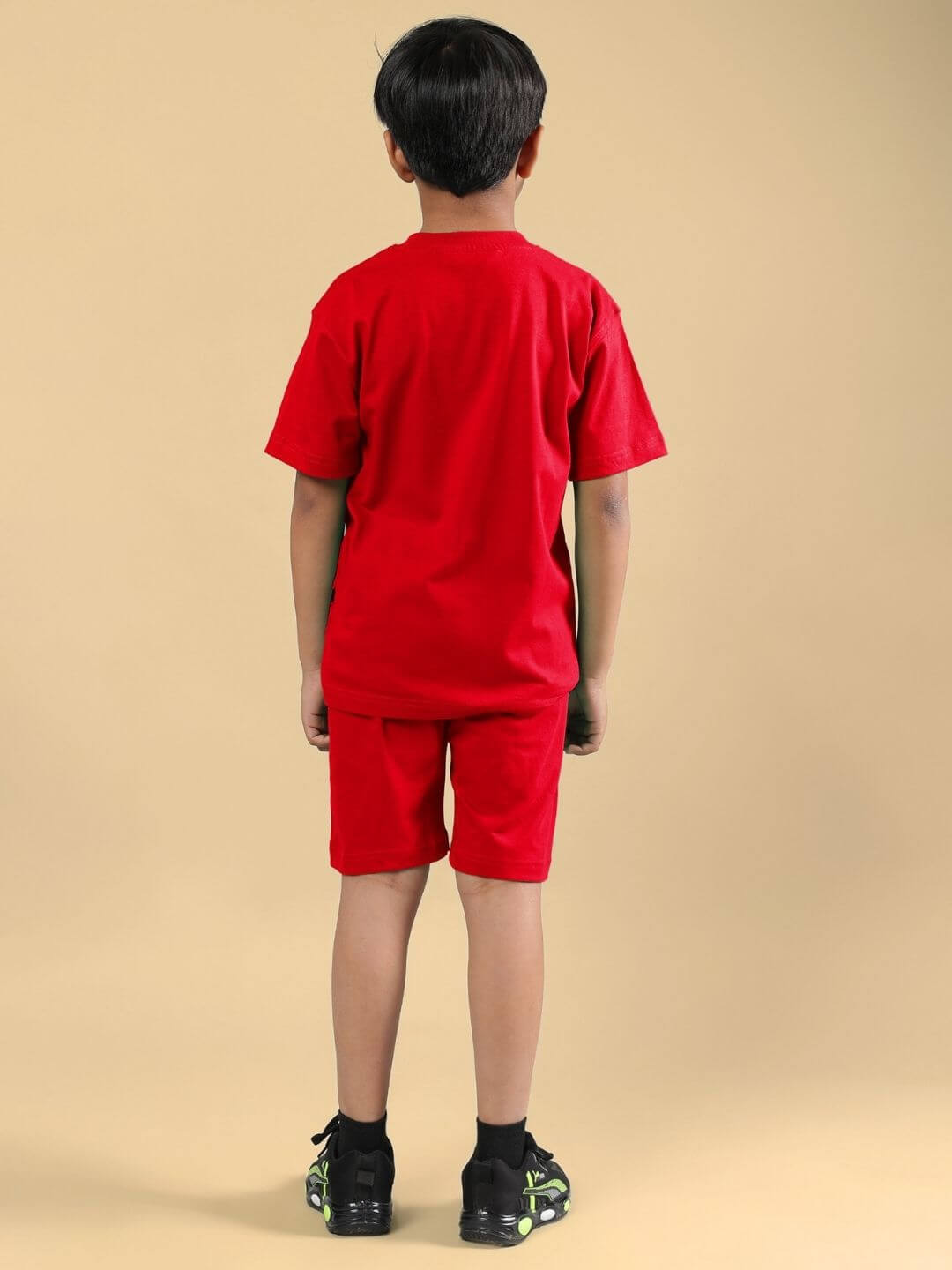 Child wearing Power Punch Co-ord set in red, featuring a comfortable T-shirt and shorts, ideal for casual style.