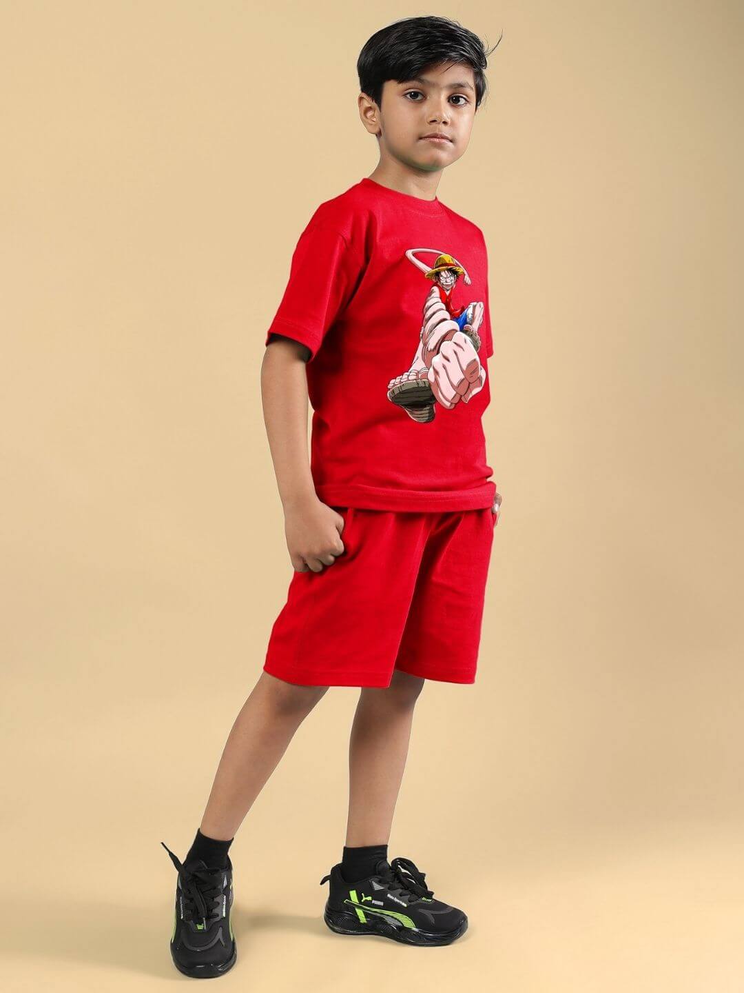 Young boy in red Power Punch Co-ord set, featuring a T-shirt and shorts, ideal for casual wear for both boys and girls.