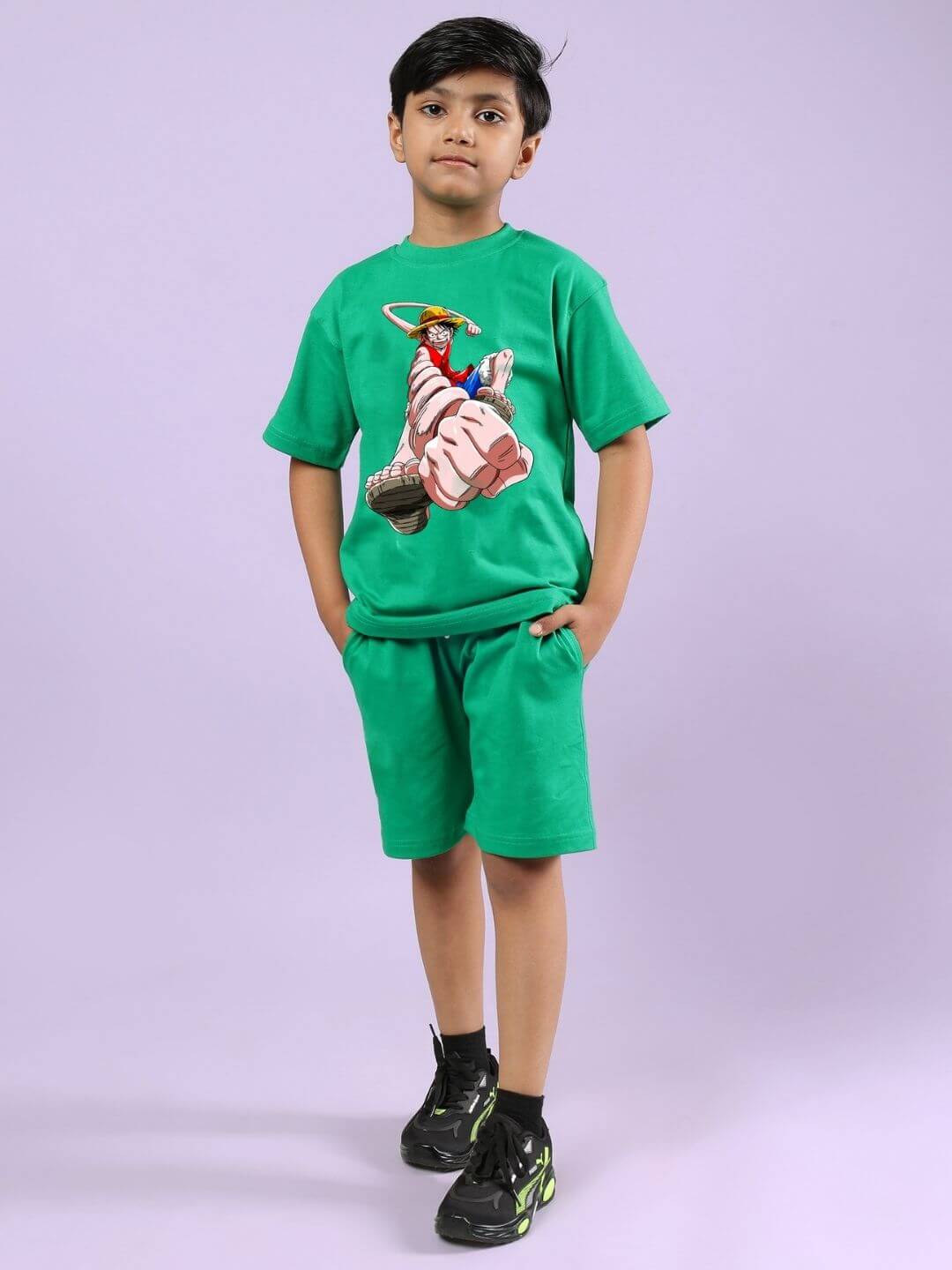 Child wearing Power Punch Co-Ord set in green with graphic top and shorts, designed for boys and girls, showcasing stylish comfort.