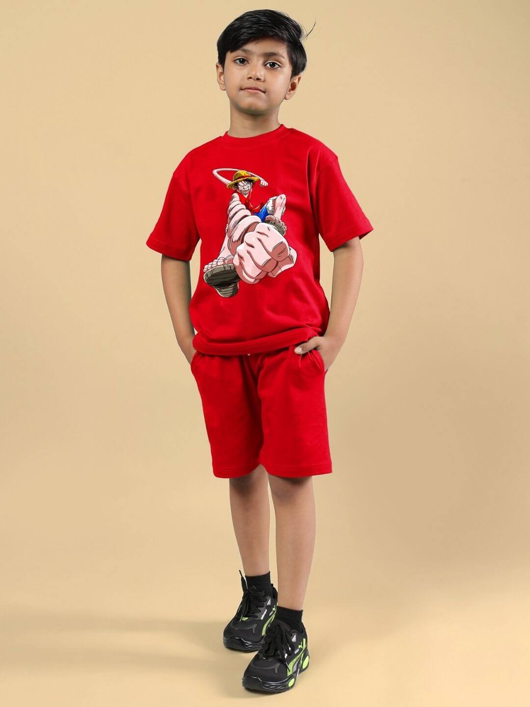 Child wearing Power Punch co-ord set in red with matching T-shirt and shorts, casual style for boys and girls.