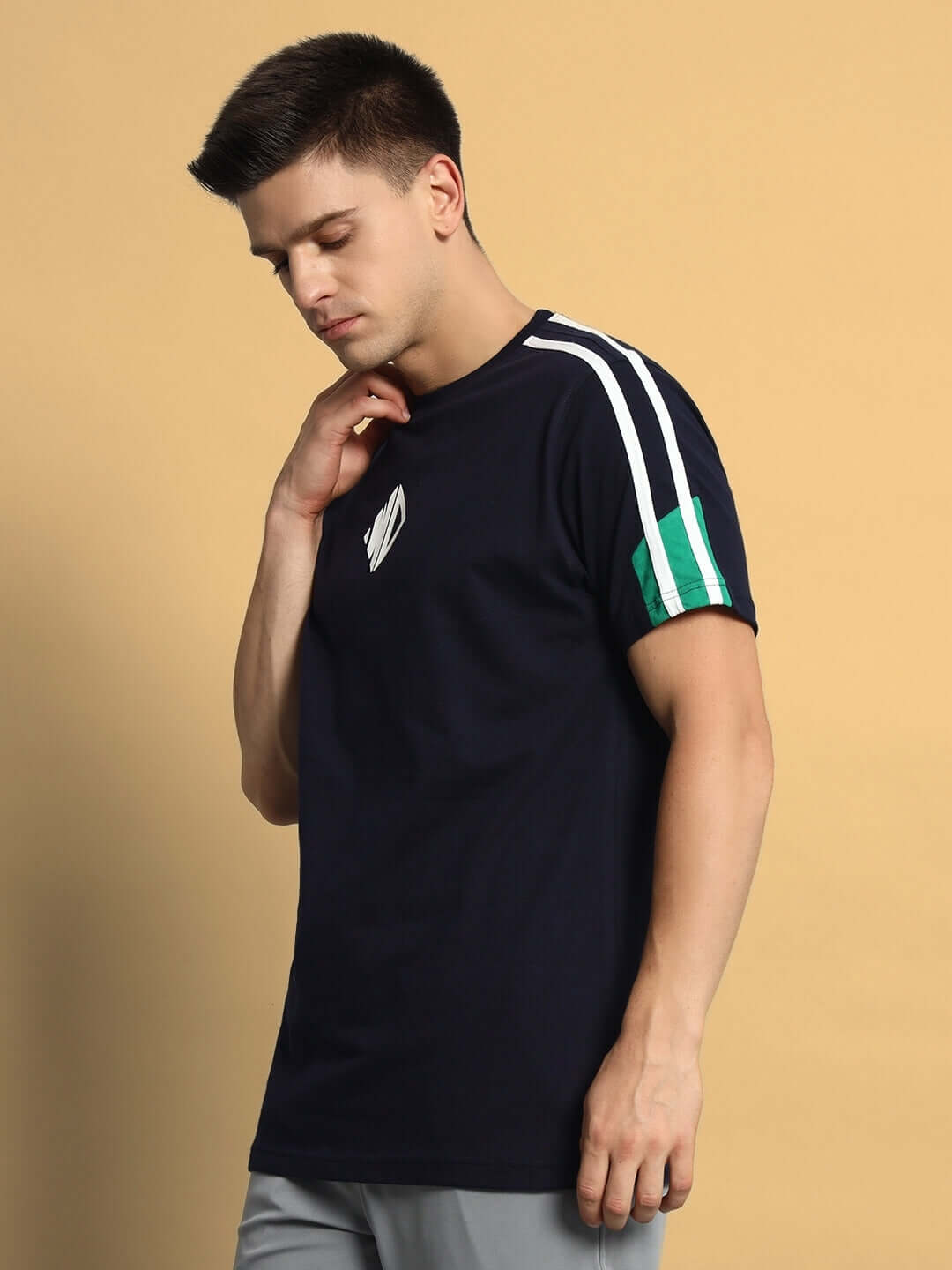 Man wearing PRIMA Regular T-Shirt in navy blue-green with white stripe detail, made from premium cotton fabric, ideal for casual wear.