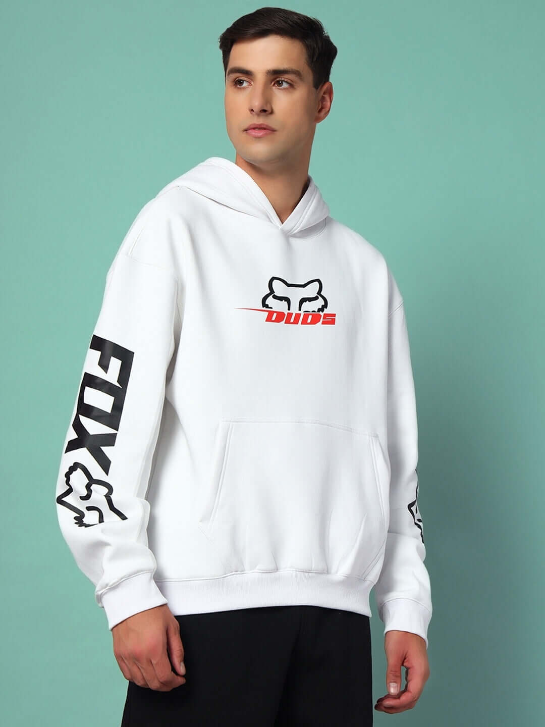Model wearing RACING FOX COTTON FLEECE HOODIE WHITE with bold logos on a teal background.