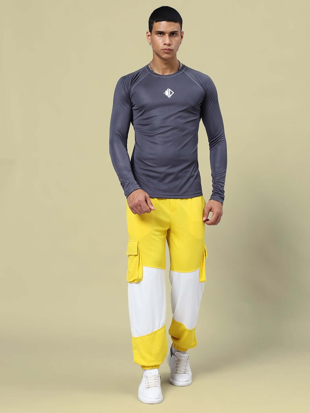 Model wearing Radiant Relaxed Fit Joggers Yellow White showcasing stylish design.