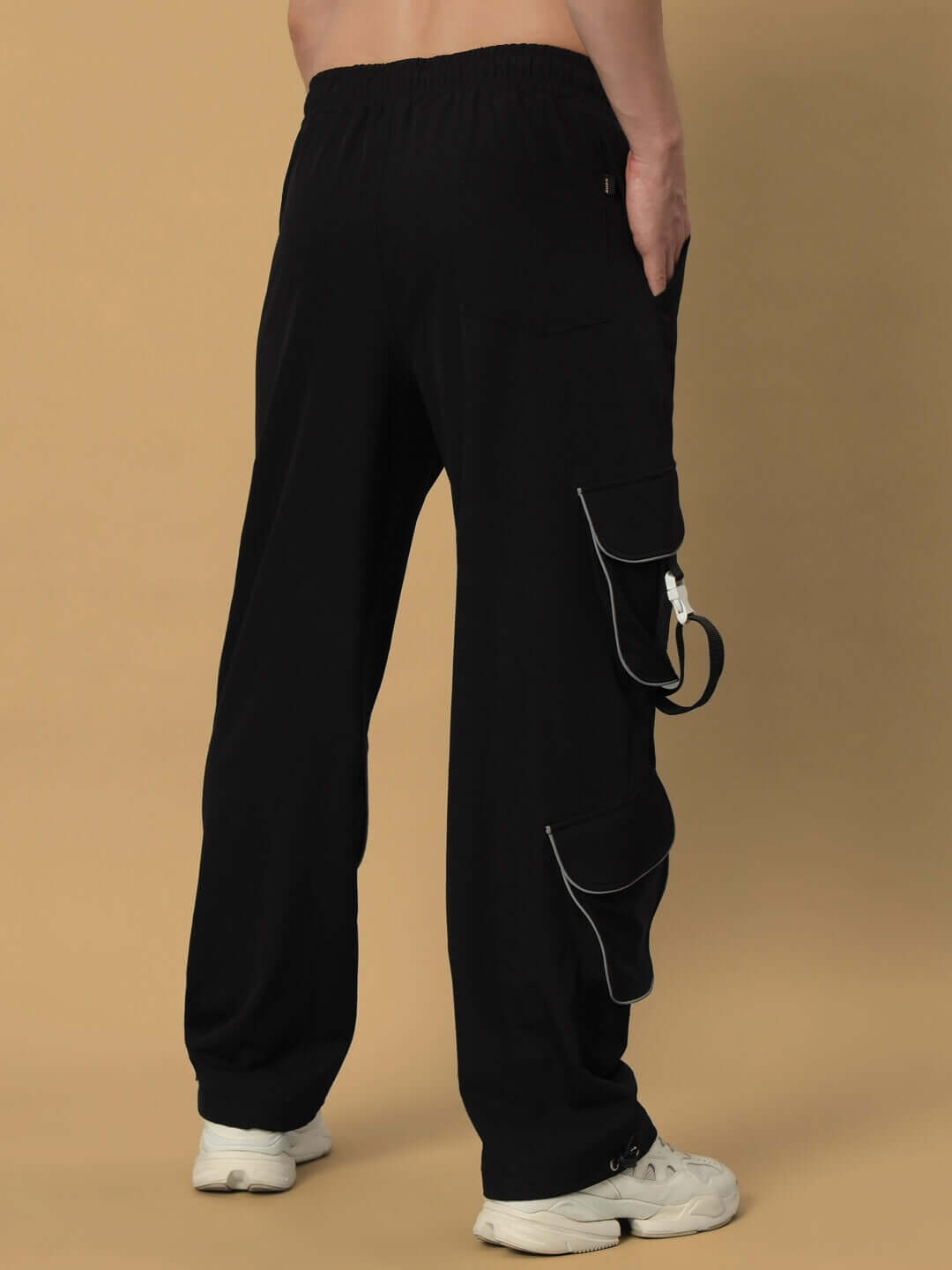 Black Ragga Reflector Parachute Cargo pants with side pockets and stylish detailing, shown from the back view.