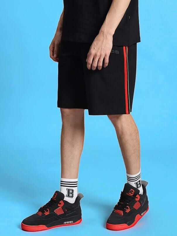 RAINBOW REGULAR FIT SHORTS BLACK worn with sneakers, showcasing style and custom fit options.