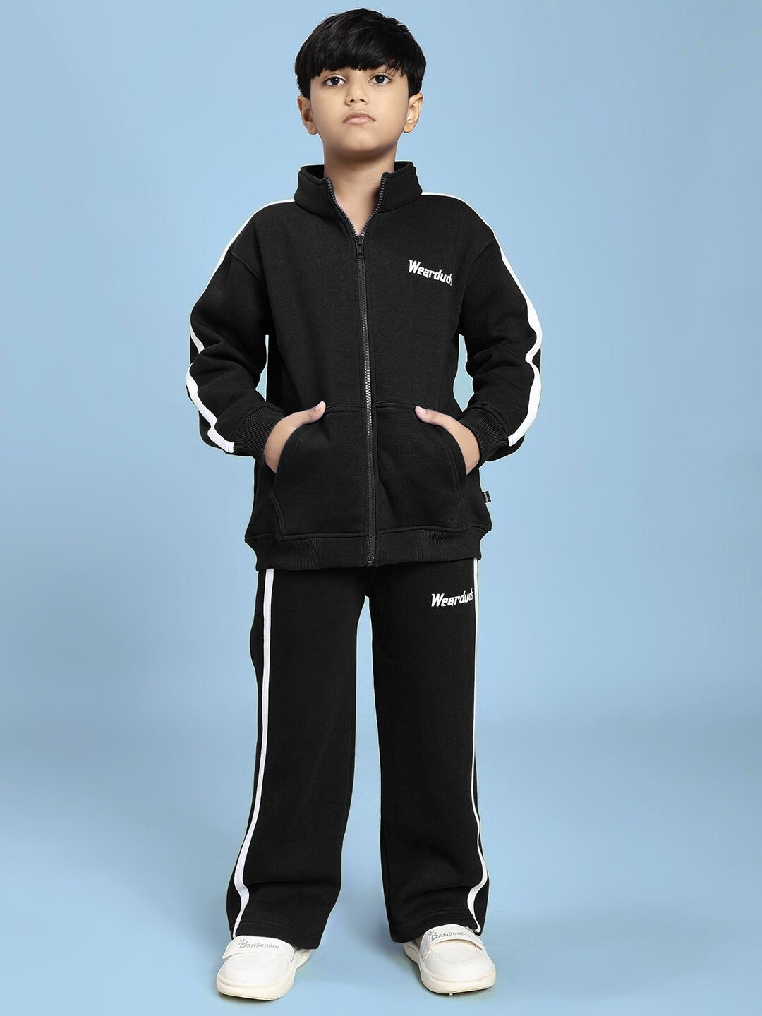 Child wearing RAPID STRIDE FLEECE CO-ORD FOR BOYS AND GIRLS BLACK, showcasing comfort and style in black sporty jacket and joggers.