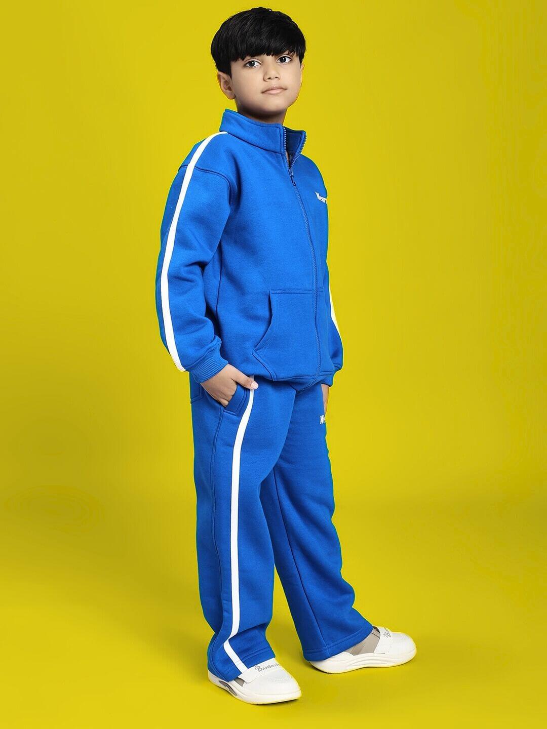 Boy wearing RAPID STRIDE FLEECE CO-ORD FOR BOYS AND GIRLS ROYAL BLUE with sporty design and white stripes on yellow background.