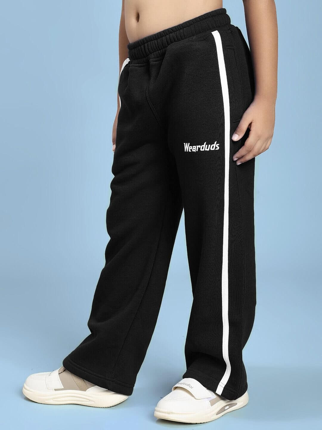 Child wearing RAPID STRIDE FLEECE CO-ORD FOR BOYS AND GIRLS BLACK with sporty design and white side stripe