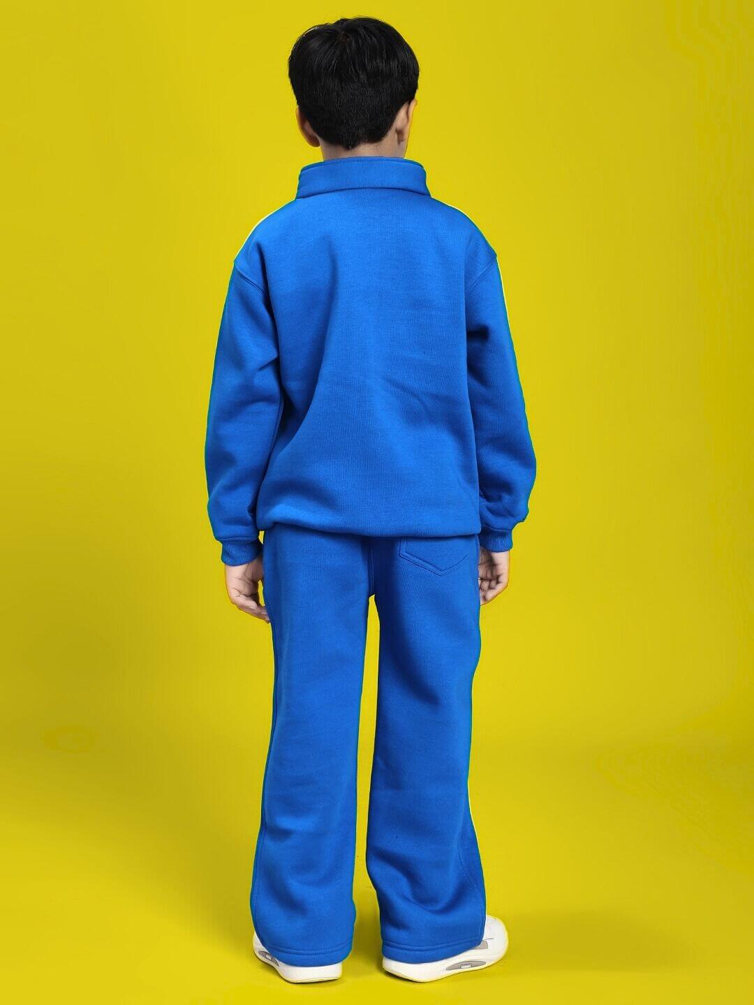 Child wearing the RAPID STRIDE FLEECE CO-ORD FOR BOYS AND GIRLS ROYAL BLUE, showing back view in vibrant yellow background.