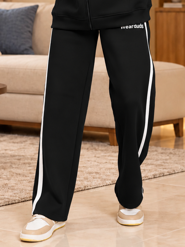 RAPID STRIDE FLEECE JOGGER BLACK with white side stripe detail, worn with casual sneakers for a sporty everyday look