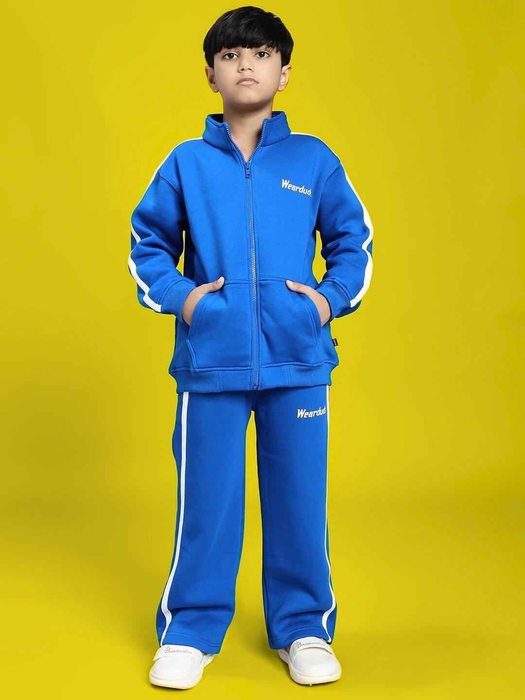 Boy wearing RAPID STRIDE FLEECE JOGGER FOR BOYS AND GIRLS ROYAL BLUE, featuring sporty style and comfort for active kids.