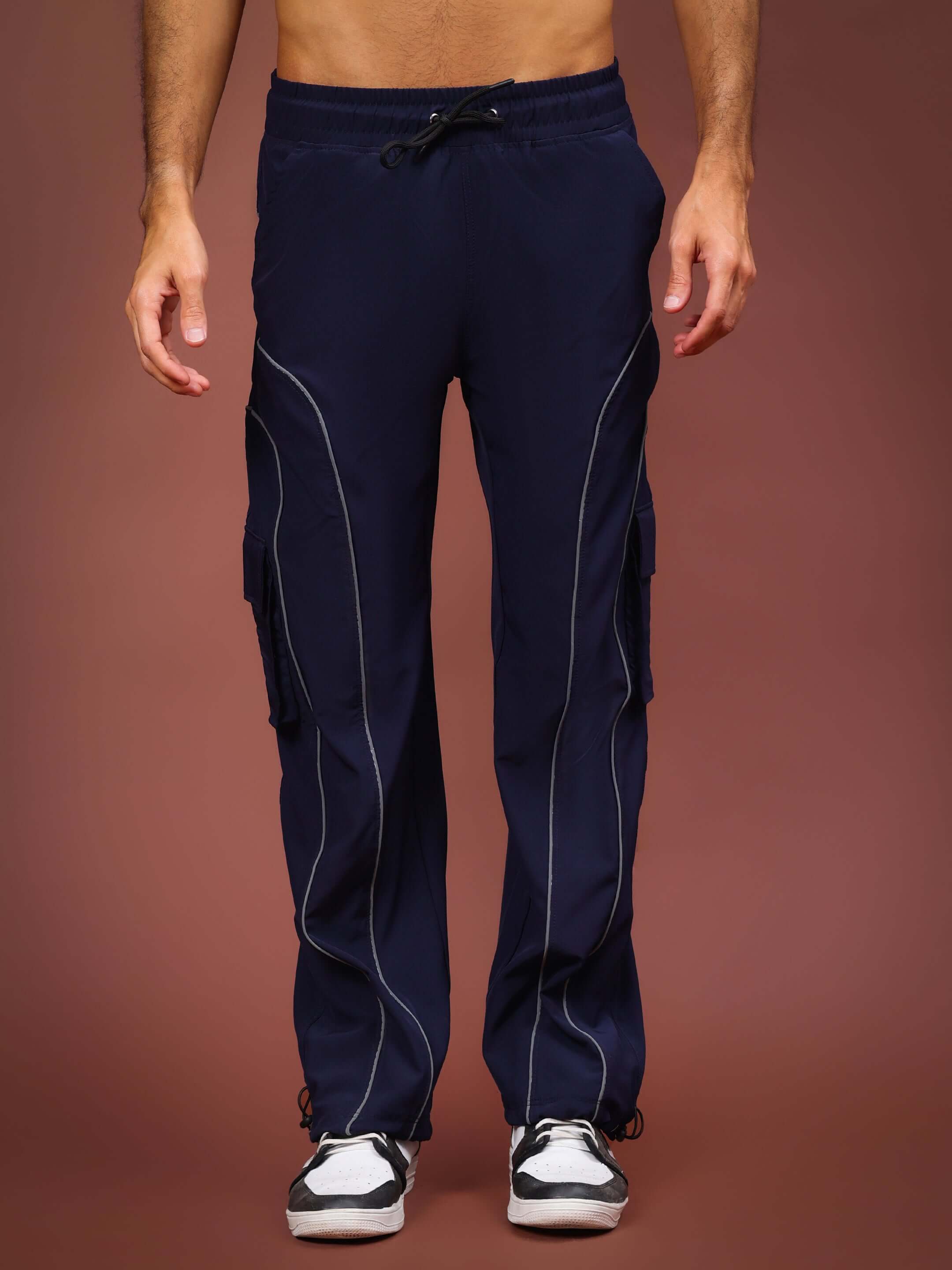 Navy blue Ray Reflector Parachute Cargo Pants with custom fit option, shown full-length on model, featuring pockets and drawstring.