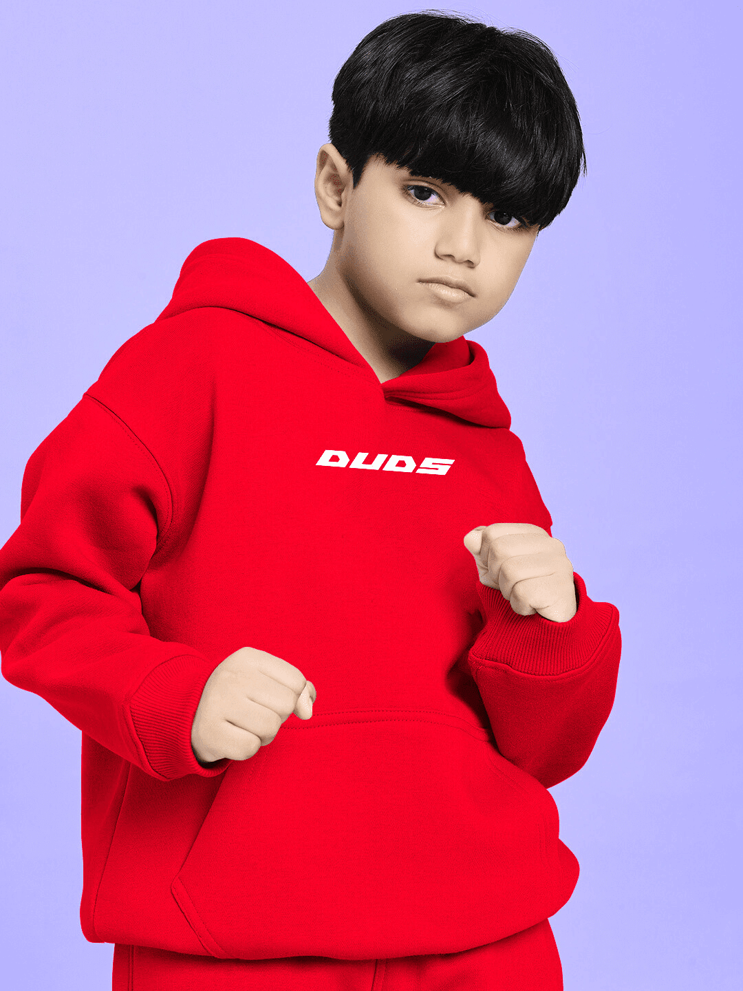 Boy wearing NEVER BE MY RIVAL PRINT FLEECE CO-ORD FOR BOYS GIRLS RED, showcasing bold red color and playful graphic print for children.