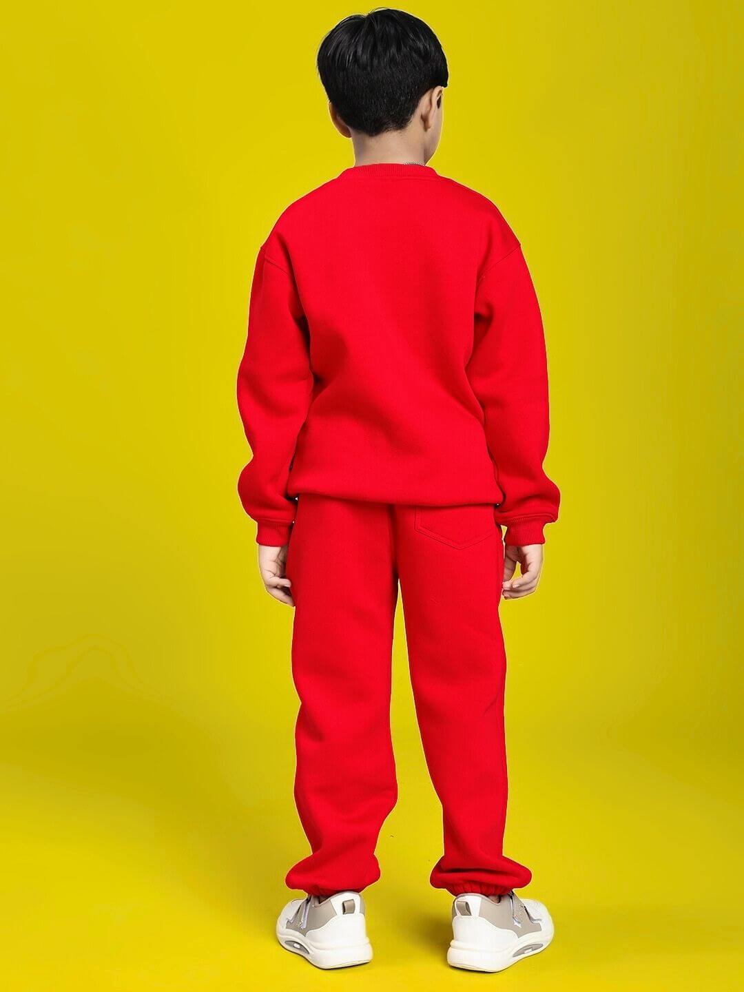 Child wearing HUG WITH THE DOG FLEECE CO-ORD FOR BOYS AND GIRLS RED, showcasing the cozy fleece material in a vibrant red color.
